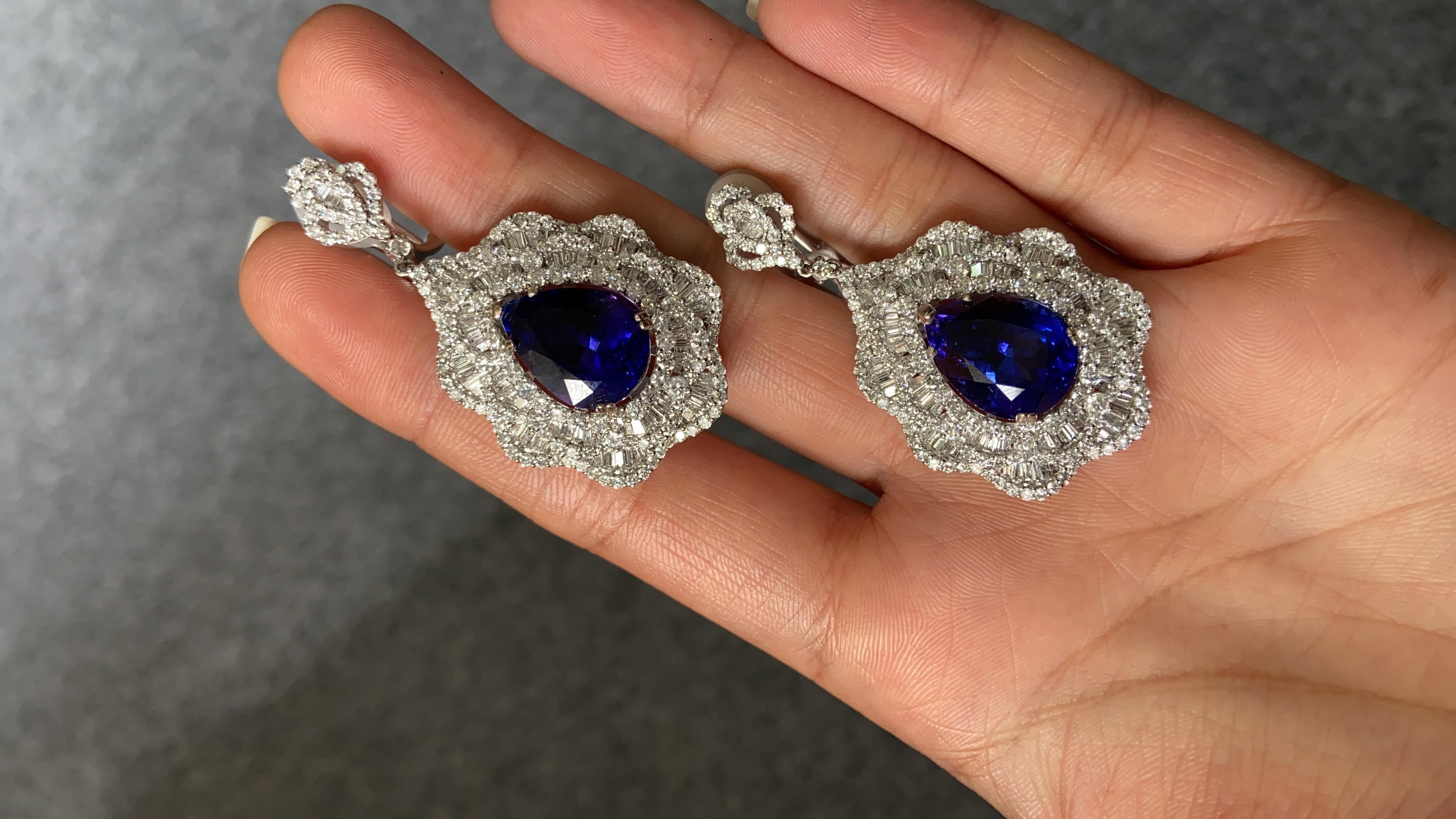 A stunning pair of 16.17 carat Tanzanite Earrings, of exceptional quality and colour. There are no inclusions in the natural stones. The custom cut, deep blue tanzanites are elegantly framed with round and bagguette diamond, set in solid 18K White