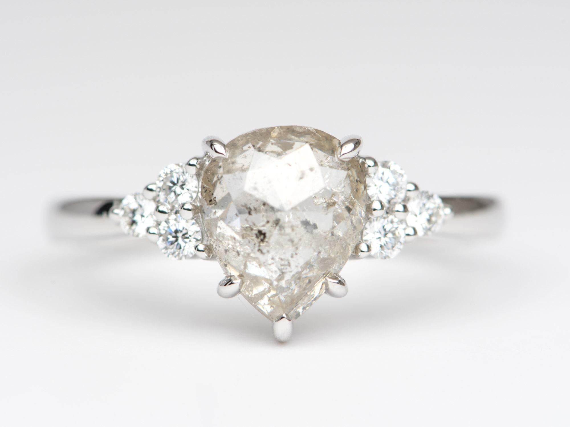 â™¥Â A clear celestial pear-shaped diamond with trio diamond sides
â™¥ Solid 14k white gold ring set with a beautiful pear-shaped diamond

â™¥ US Size 7 (Free resizing up or down 1 size)
â™¥ Gemstone: Diamond, 1.61ct; diamond, 0.17ct
â™¥ All