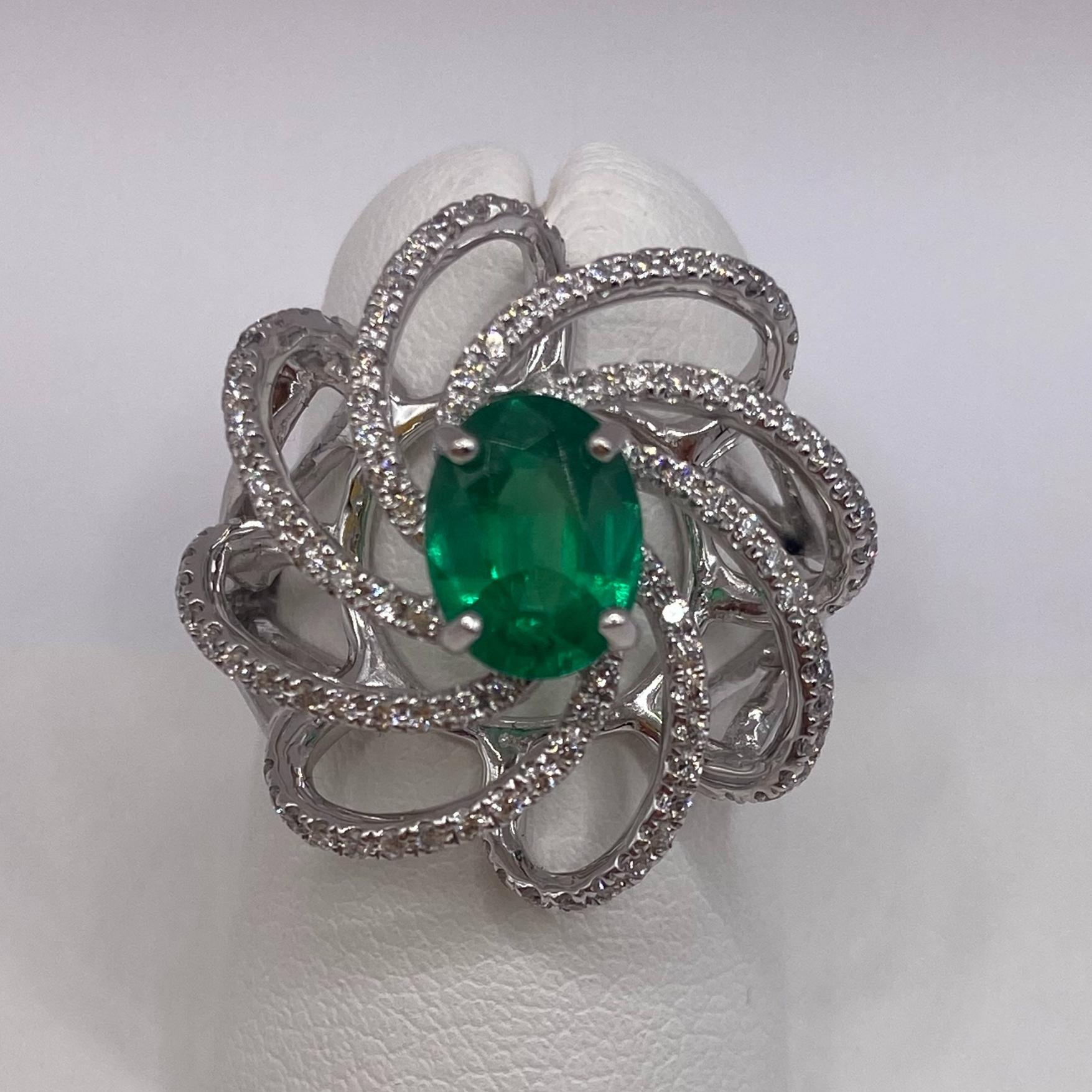 18KT White Gold
Ring Size: 6.5
(Ring is size 6.5, but is sizable upon request)

Number of Oval Emeralds: 1
Carat Weight: 1.13ctw
Stone Size: 8.0 x 6.25mm

Number of Round Diamonds: 108
Carat Weight: 0.48ctw