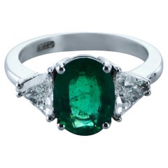 Oval Emerald 1.61 Carat 
0.82 Carat Diamond 18kt White Gold Cocktail Ring