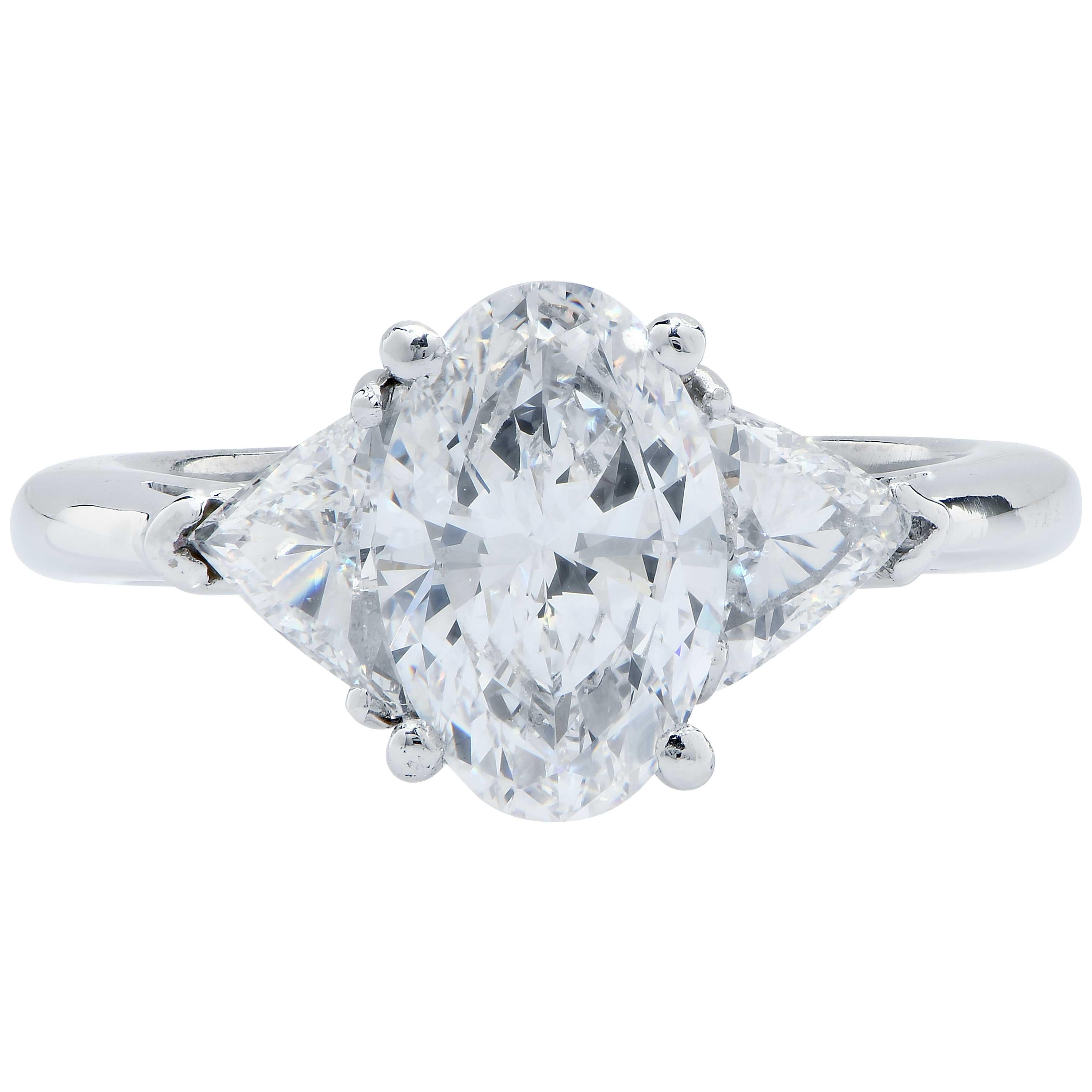 1.62 Carat GIA Graded D/VS2 Oval Cut Diamond Platinum Engagement Ring. 
This beautiful ring features a lively oval shaped diamond flanked by two trilliant cut diamonds with a total weight of .62 carat. 
