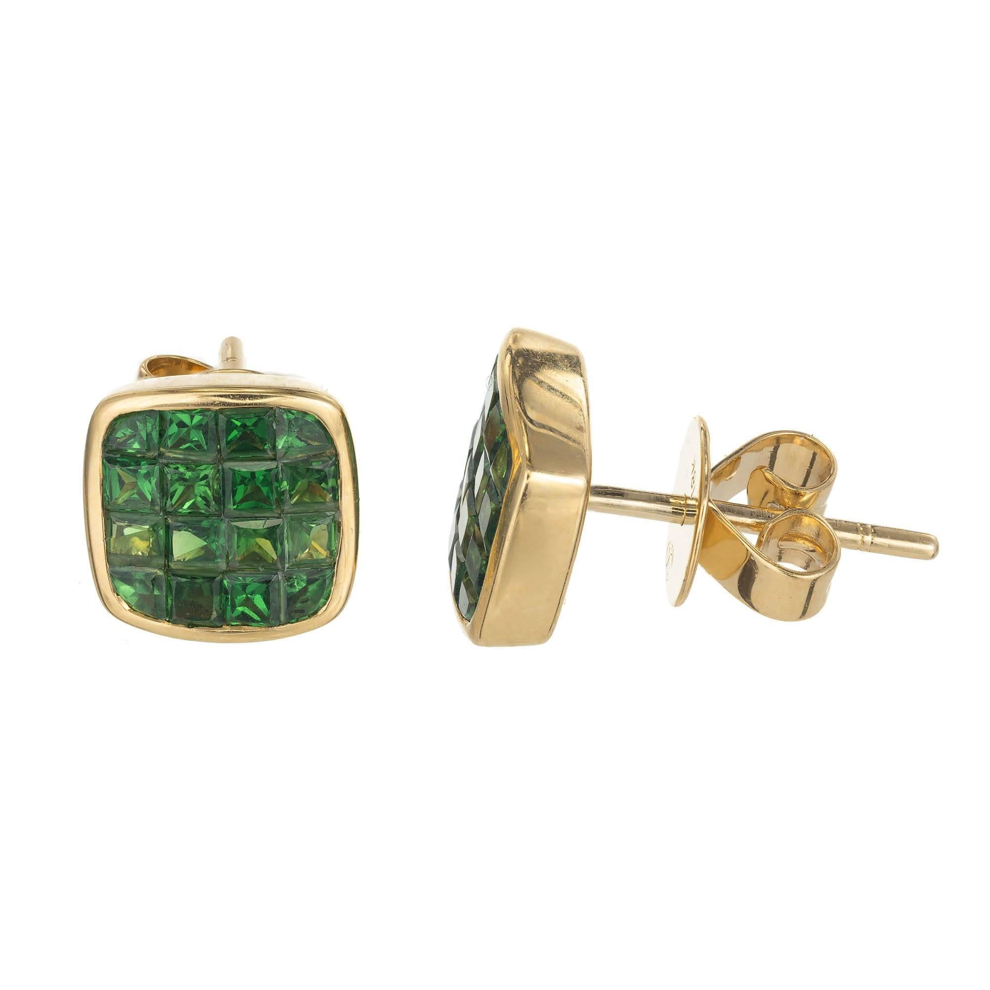 Bright green square Tsavorite Garnet stud earrings. 32 square cut Tsavorite garnets approx. total weight 1.62cts set in 18k yellow gold frames. Top vivid green color.

32 square Tsavorite Garnets approx. total weight 1.62cts.
18k Yellow Gold
Stamped