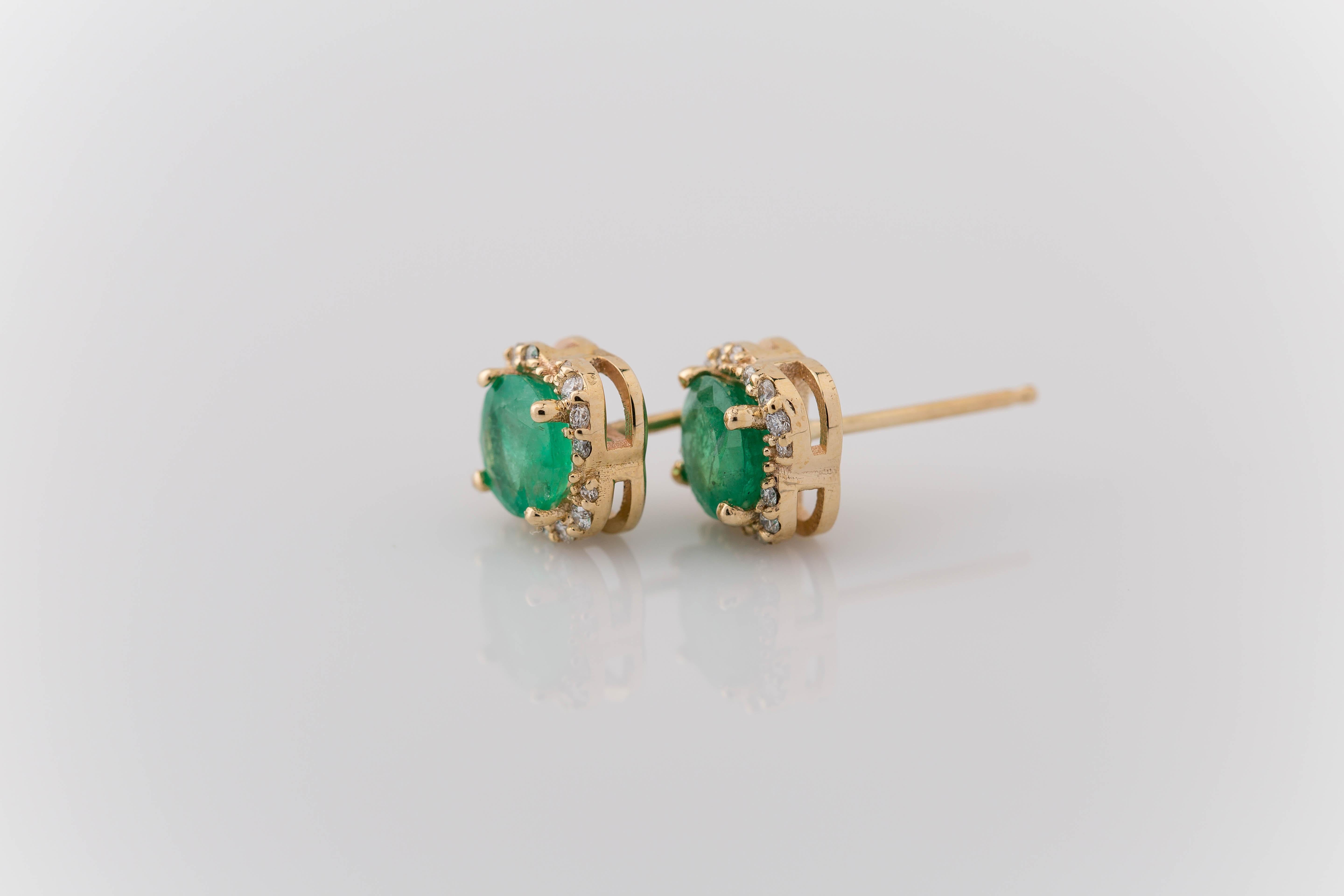 Introducing our elegant 1.62 Carat Emerald Diamond Halo Stud Earrings, where sophistication meets allure. Each earring features a dazzling 6mm round brilliant cut natural Brazilian emerald, evoking the lush greens of nature's landscapes. Encircling