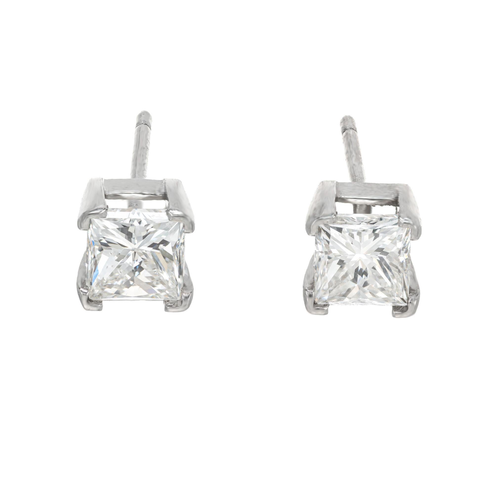 Diamond stud earrings. 2 princess cut diamonds, together approximately 1.62cts. Both are set in 4 prong platinum settings. Both are near colorless with and F grading. 
Follow us on our 1stdibs storefront to view our weekly new additions and 5 Star
