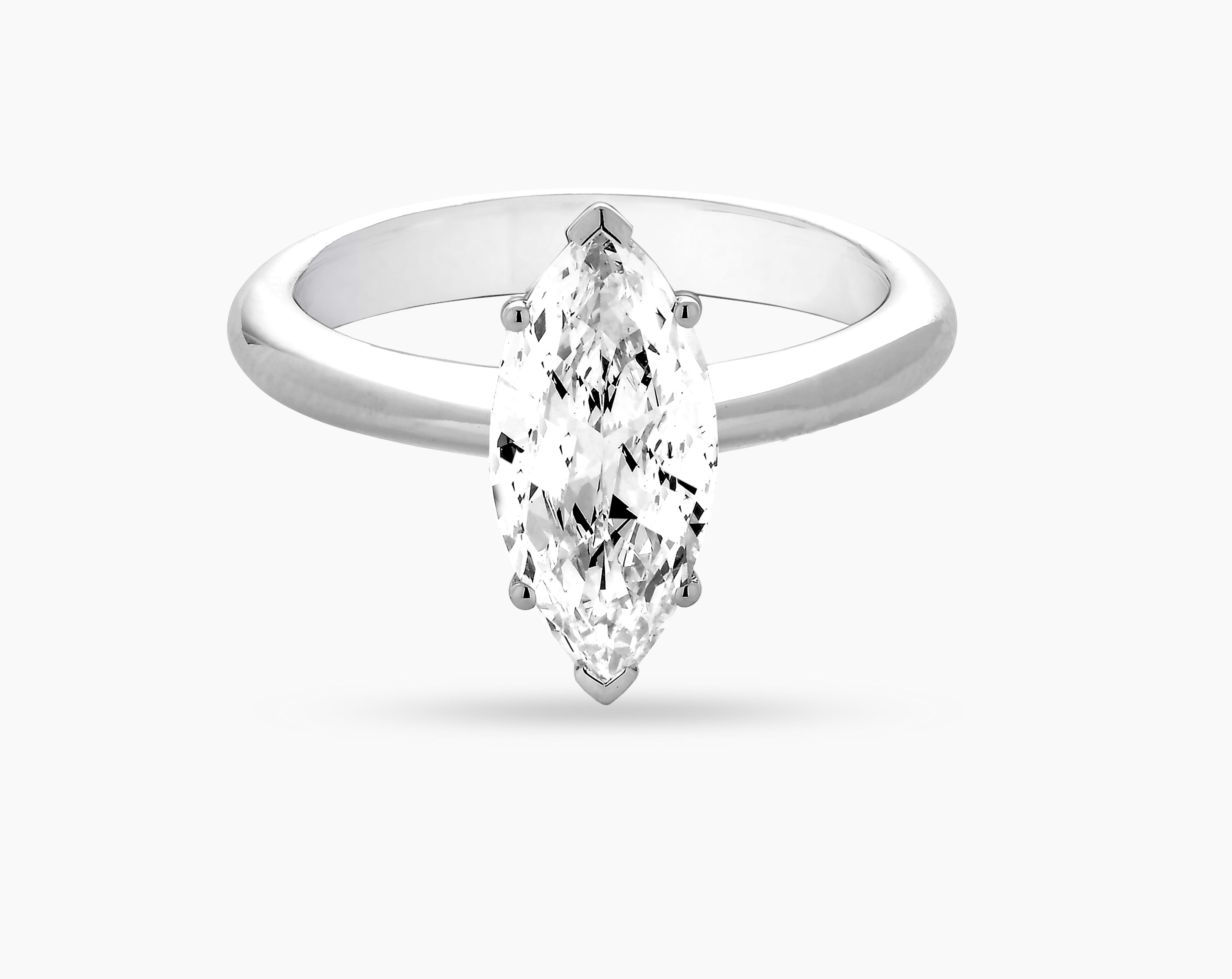 IGI (International Gemological Institute, Antwerp) certified VVS2 diamond 1.62 carat engagement ring. Marquise cut solitaire engagement ring in 18k white gold with E colour VVS2 clarity center stone from CARON Fine Jewellery.

Elegance is combined