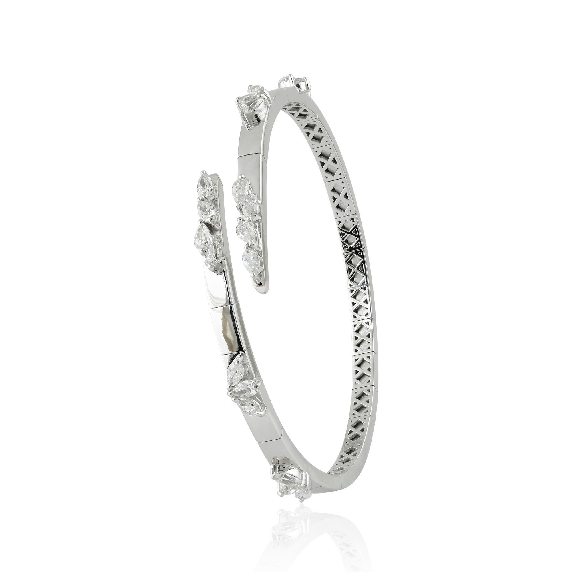 This stunning cluster diamond bangle is the perfect way to add some sparkle and glamour to your jewelry collection. Handcrafted with care and attention to detail, it is a timeless piece that you'll love wearing for years to come.

This is a perfect