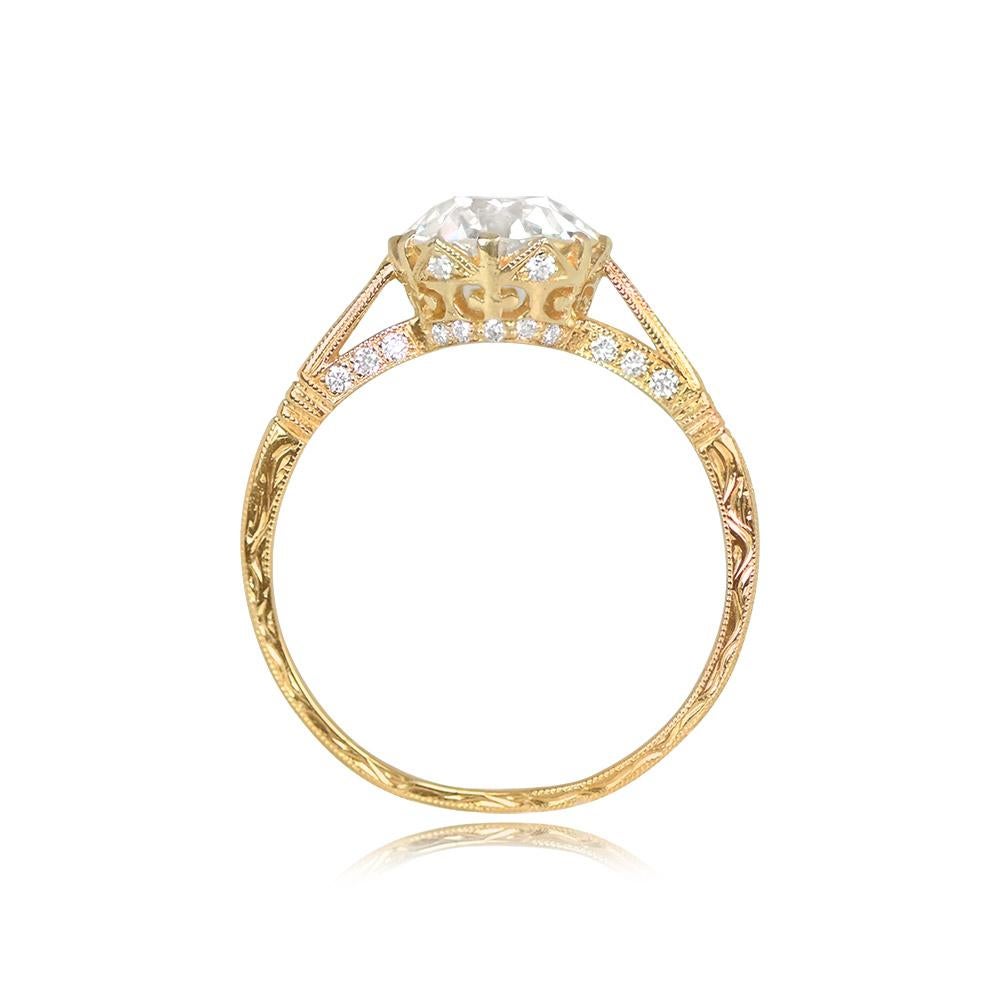 Presenting an exquisite crown-style solitaire engagement ring, featuring a magnificent antique old European cut diamond at its center, weighing 1.62 carats, with J color and VS1 clarity. The allure of this vintage diamond is a true testament to its