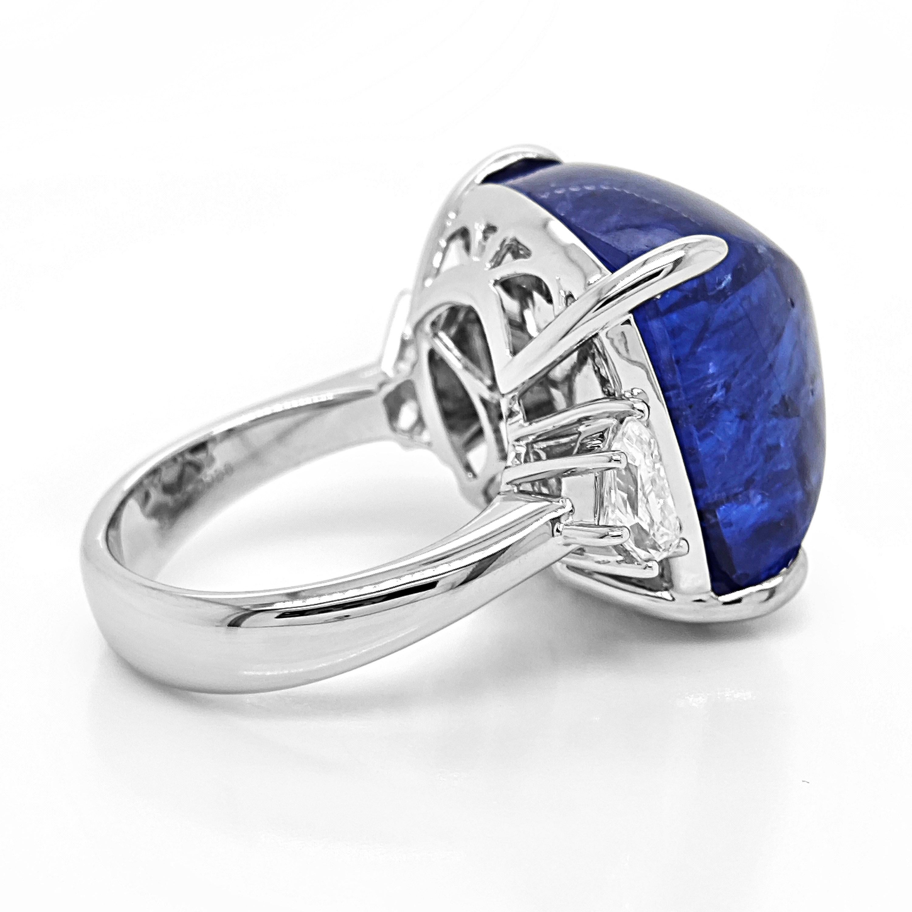 1 Tanzanite Gemstone: 15.63 Carats
2 White Diamonds: 0.57 Carat
Metal: 18K White Gold, 8.30 Grams