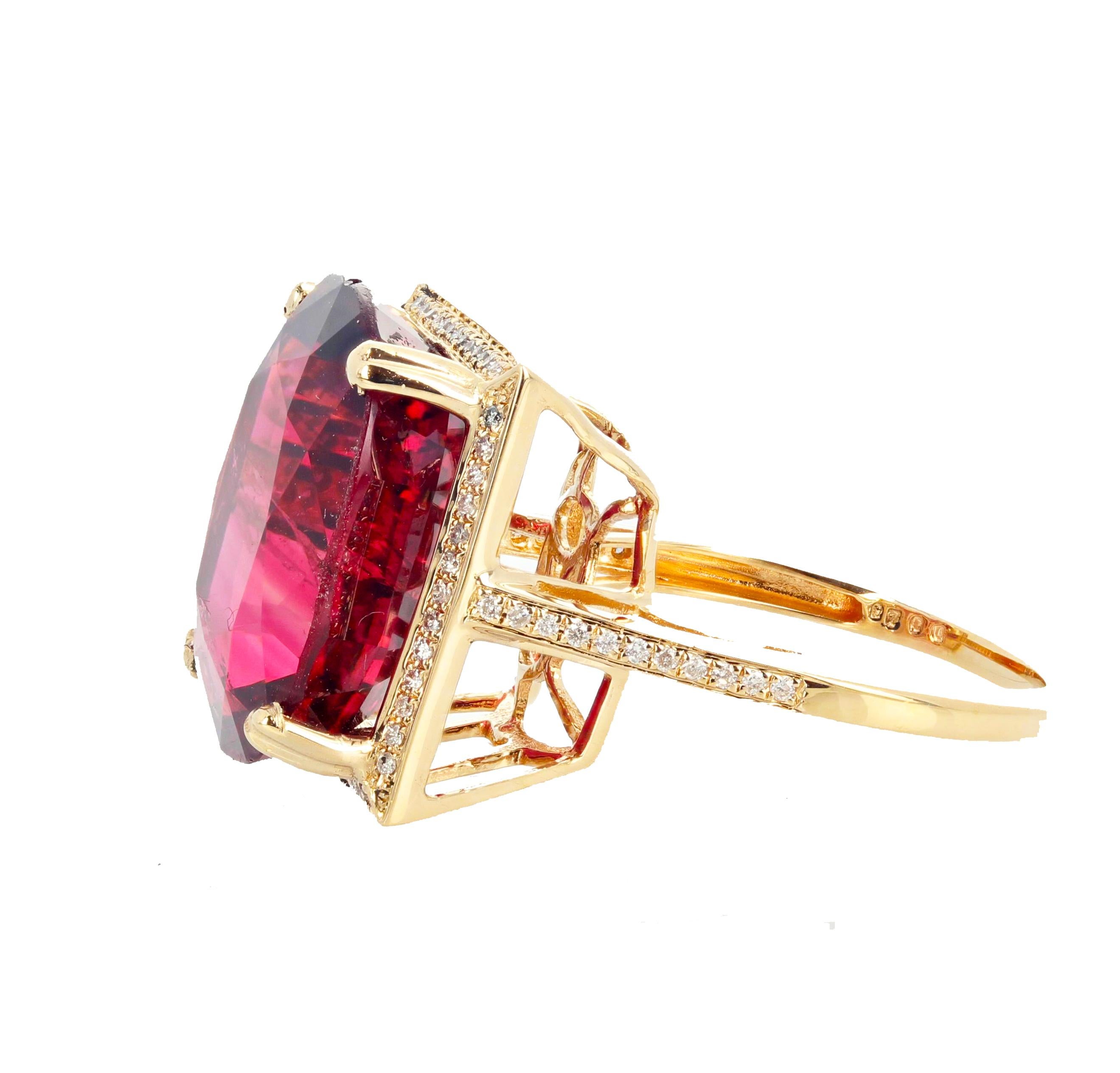Gemjunky Glittering brilliant natural red 16.21 carat Tourmaline - 17 m x 16 mm - set in this beautiful white diamond enhanced 14KT yellow gold ring size 7 sizable FOR FREE.  There are natural inclusions too small to appear in the photograph (or