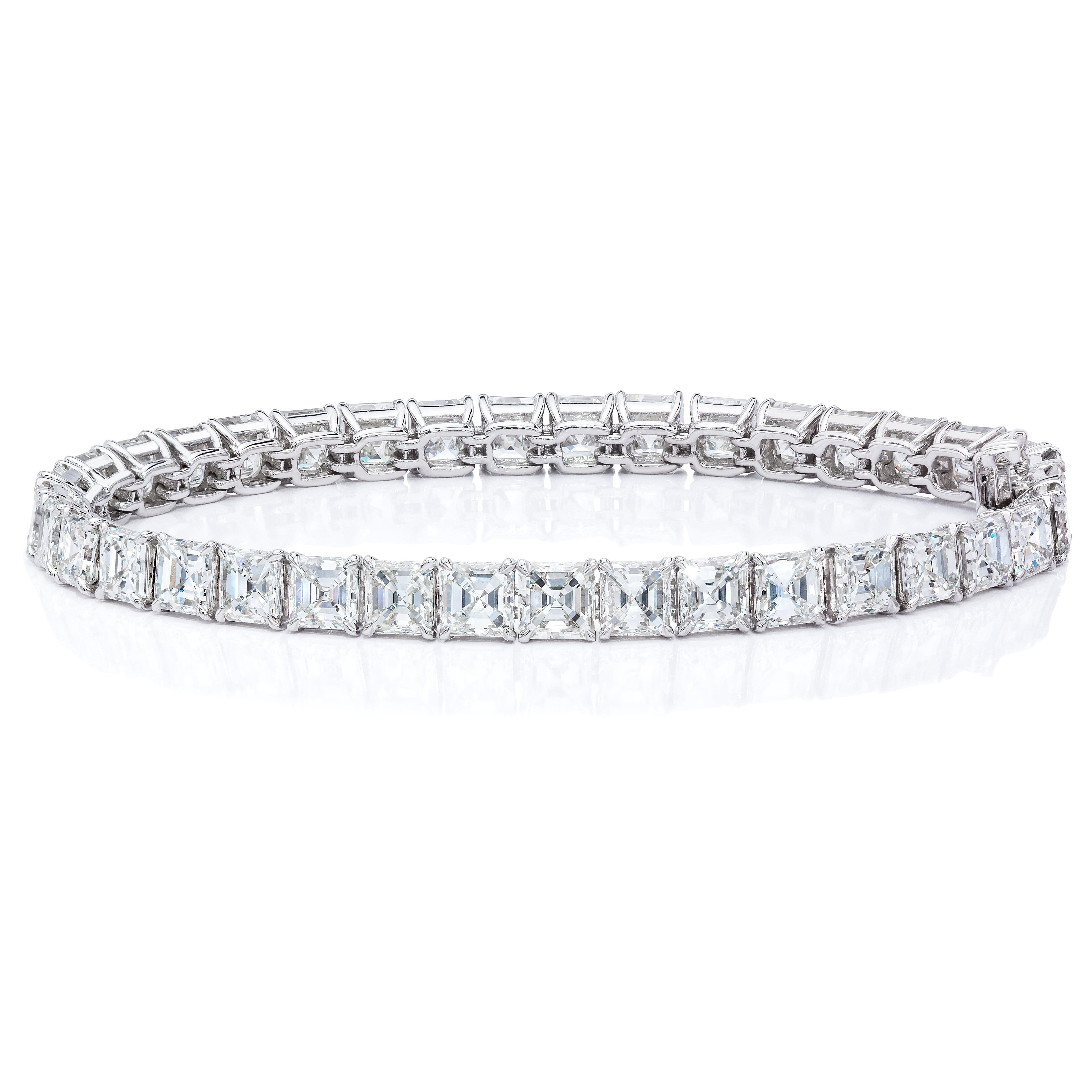 This beautiful bracelet features 37 perfectly matched Asscher Cuts in a single line Tennis Bracelet setting totaling 16.22 Carats.
Each Stone weights approximately 43points each.
Set in 18 Karat White Gold.
Measures 6.75 inches.