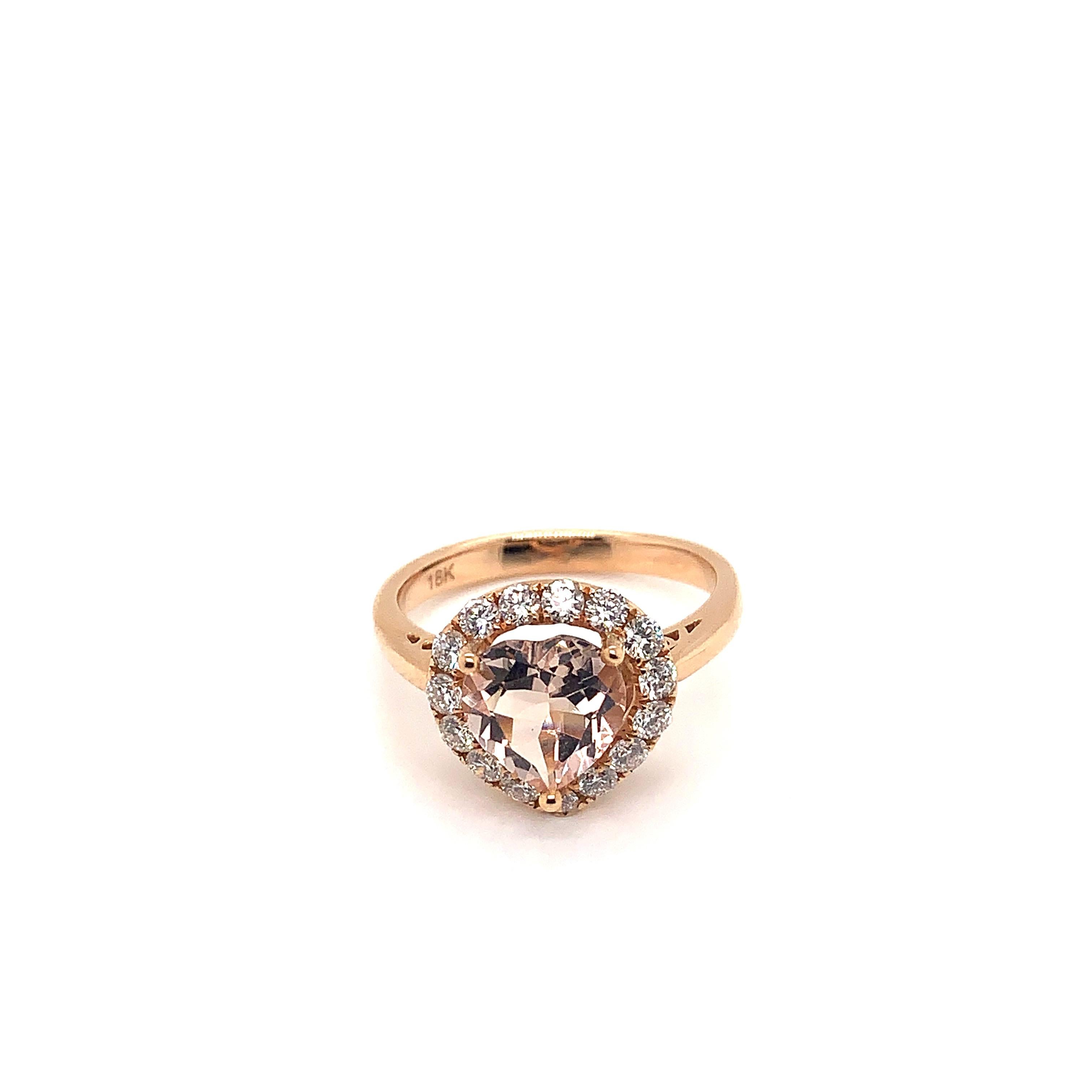 Classic morganite ring in 18K rose gold with diamonds. 

Morganite: 1.629 carat heart shape.
Diamonds: 0.558 carat, G colour, VS clarity. 
Gold: 4.188g, 18K rose gold. 