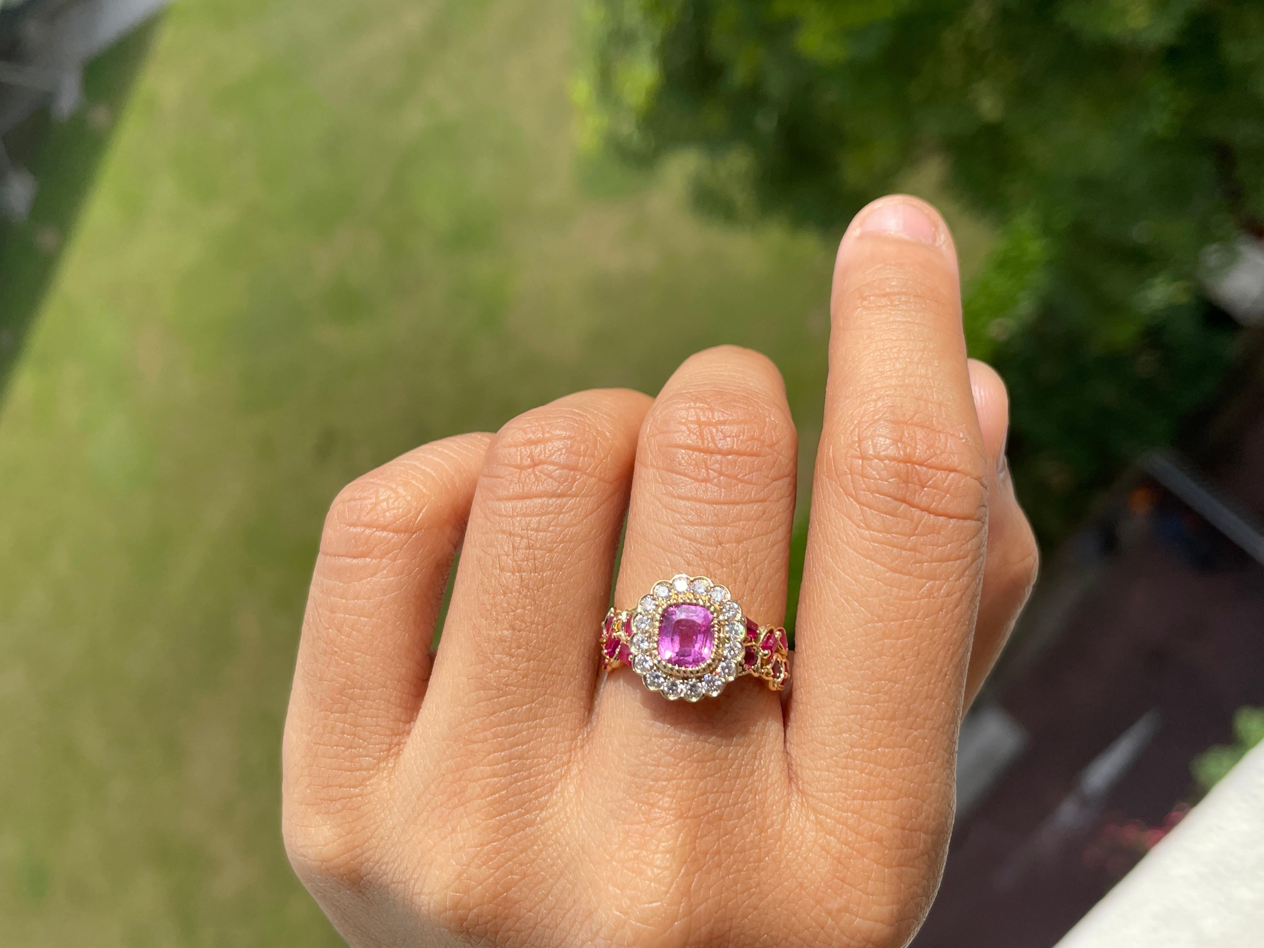This ring features a 1.62-carat no-heat Burma pink sapphire and ruby. Its vintage-inspired design, adorned with clustered Burma rubies along the shank and encircled by dazzling diamonds, exudes timeless elegance and unparalleled sophistication.