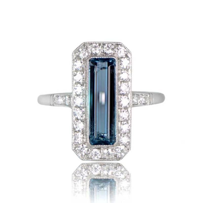 This gemstone ring showcases an elongated emerald-cut 1.62-carat aquamarine encircled by a halo of old European cut diamonds. The central aquamarine boasts the coveted Santa Maria color with deep saturation, representing the finest hue for
