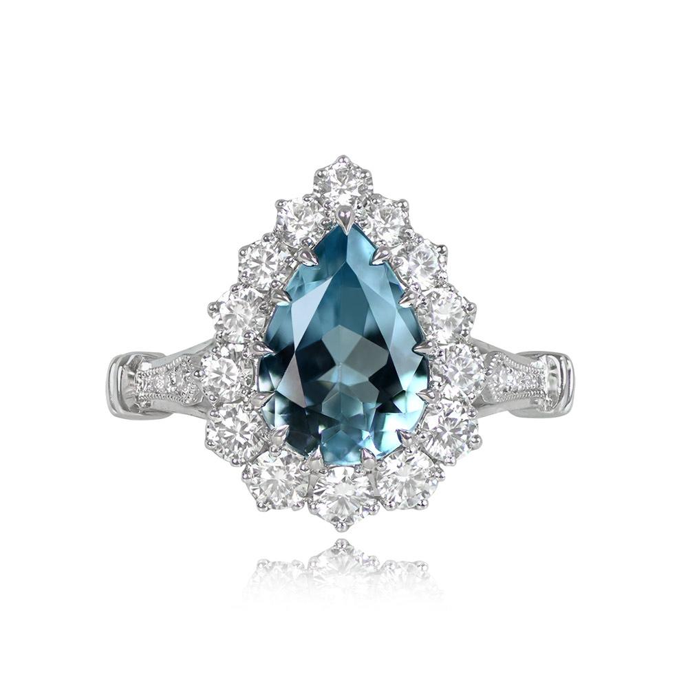 An impressive cluster ring with a prong-set pear-shaped aquamarine weighing around 1.62 carats. It's adorned by a cluster of round brilliant-cut diamonds, approximately 0.70 carats in total. Crafted in platinum.


Ring Size: 6.5 US, Resizable
Metal:
