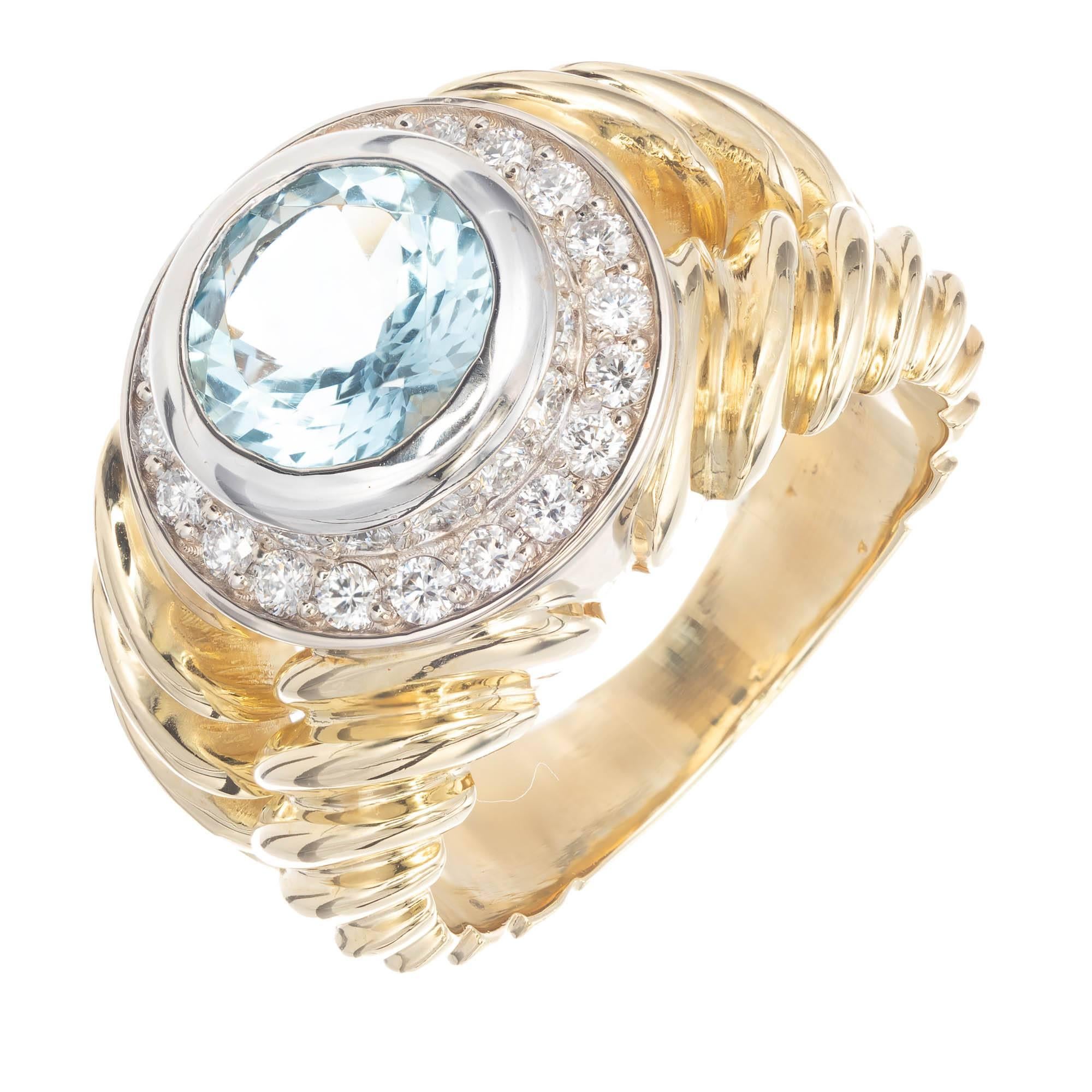 Aqua and diamond halo Solid 18k yellow and white gold double row swirl design cocktail ring. White gold top with two rows of bead set fine white full cut diamonds and a bright gem cut Aqua. 

1 round European cut untreated Aqua, approx. total weight