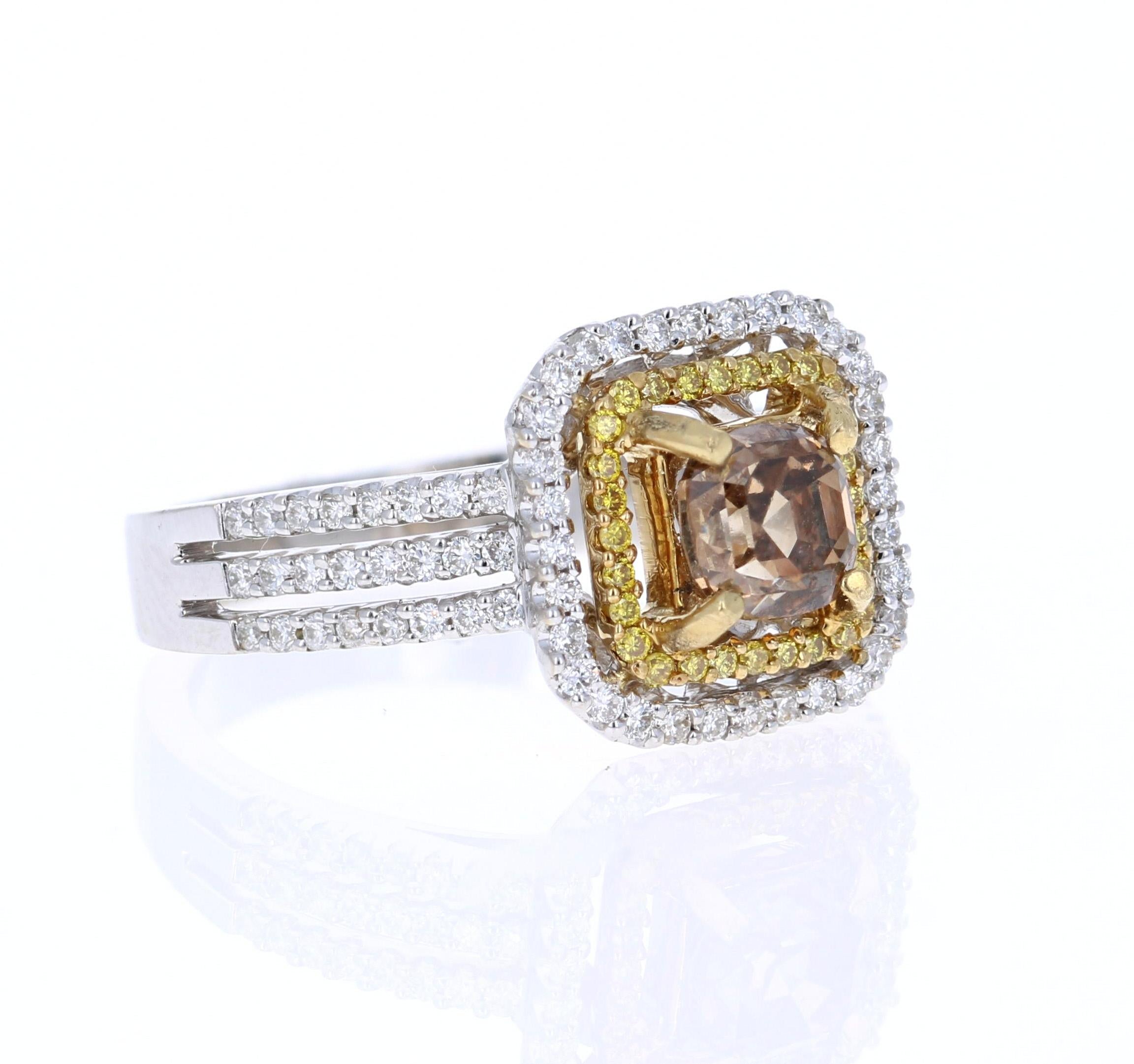 This ring has a 1.03 Carat Asscher Cut Natural Champagne Diamond Clarity (SI1) which is surrounded by 88 Round Cut Diamonds that weigh 0.45 Carats and also 28 Yellow Diamonds that weigh 0.15 Carats. The total carat weight of the ring is 1.63 Carats.