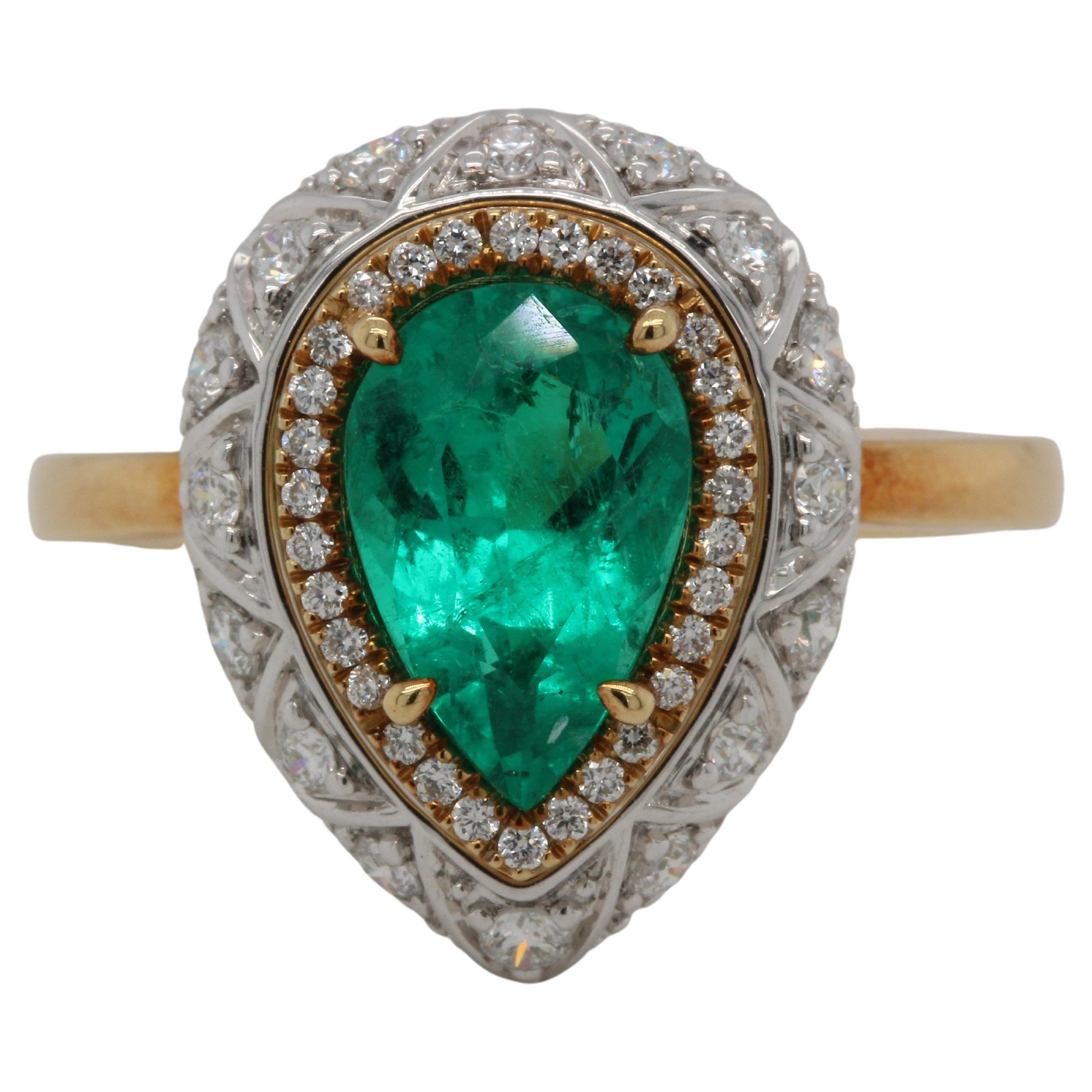 Graceful and elegant, our gorgeous emerald and diamond ring is a timeless symbol of love. A stunning 1.63 carat emerald pear sits set with dazzling white diamonds, making this one-of-a-kind piece a must-have addition to any woman’s jewelry box or