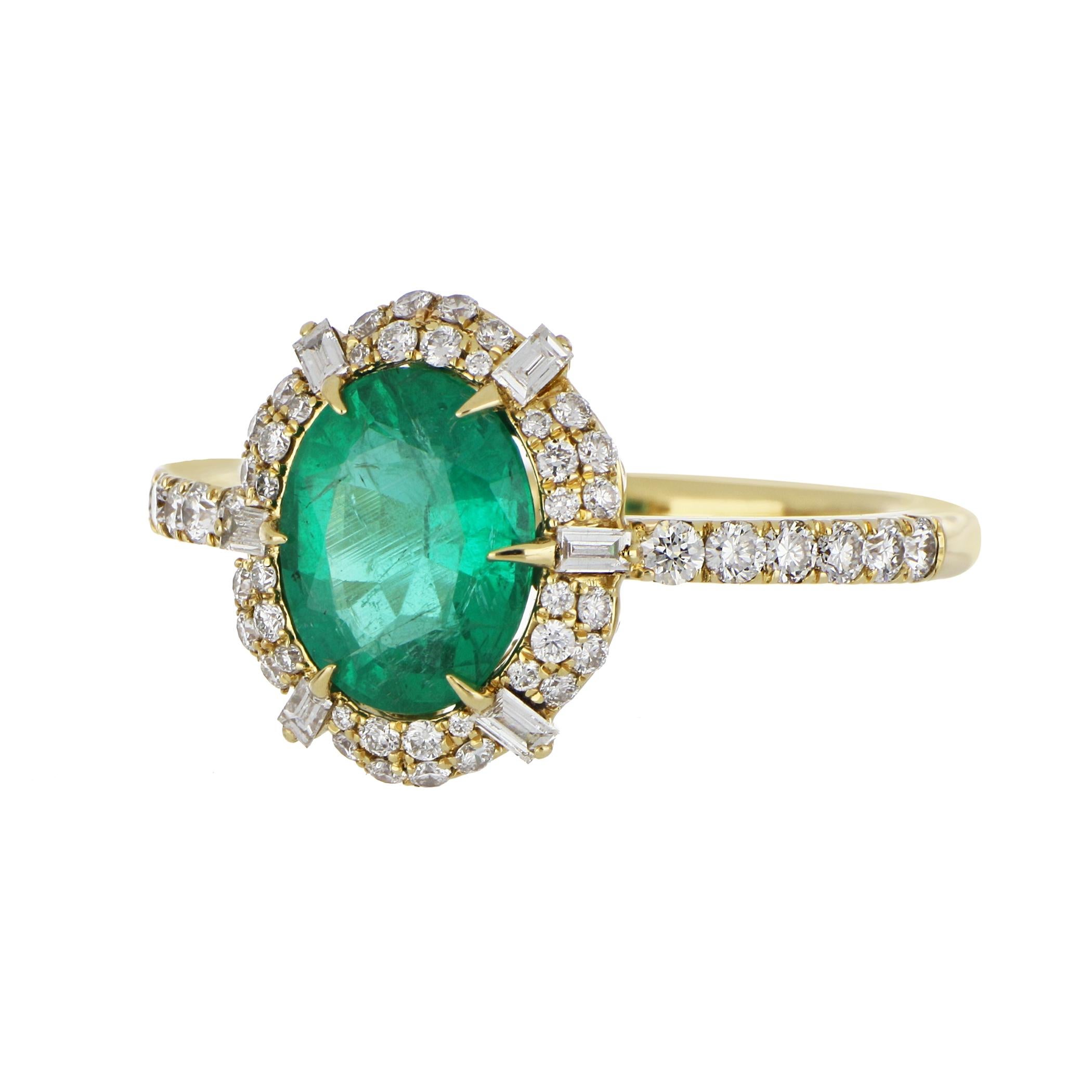 Elegant and exquisitely detailed Cocktail 18 K Ring, centre set with 1.63Cts. Oval Cut Emerald. Surrounded 
 and enhanced with Diamonds, weighing approx. 0.54 cts. Beautifully Hand crafted in 18 Karat Yellow Gold.

Stone Size:
Emerald: 9.1 x 7.1 mm