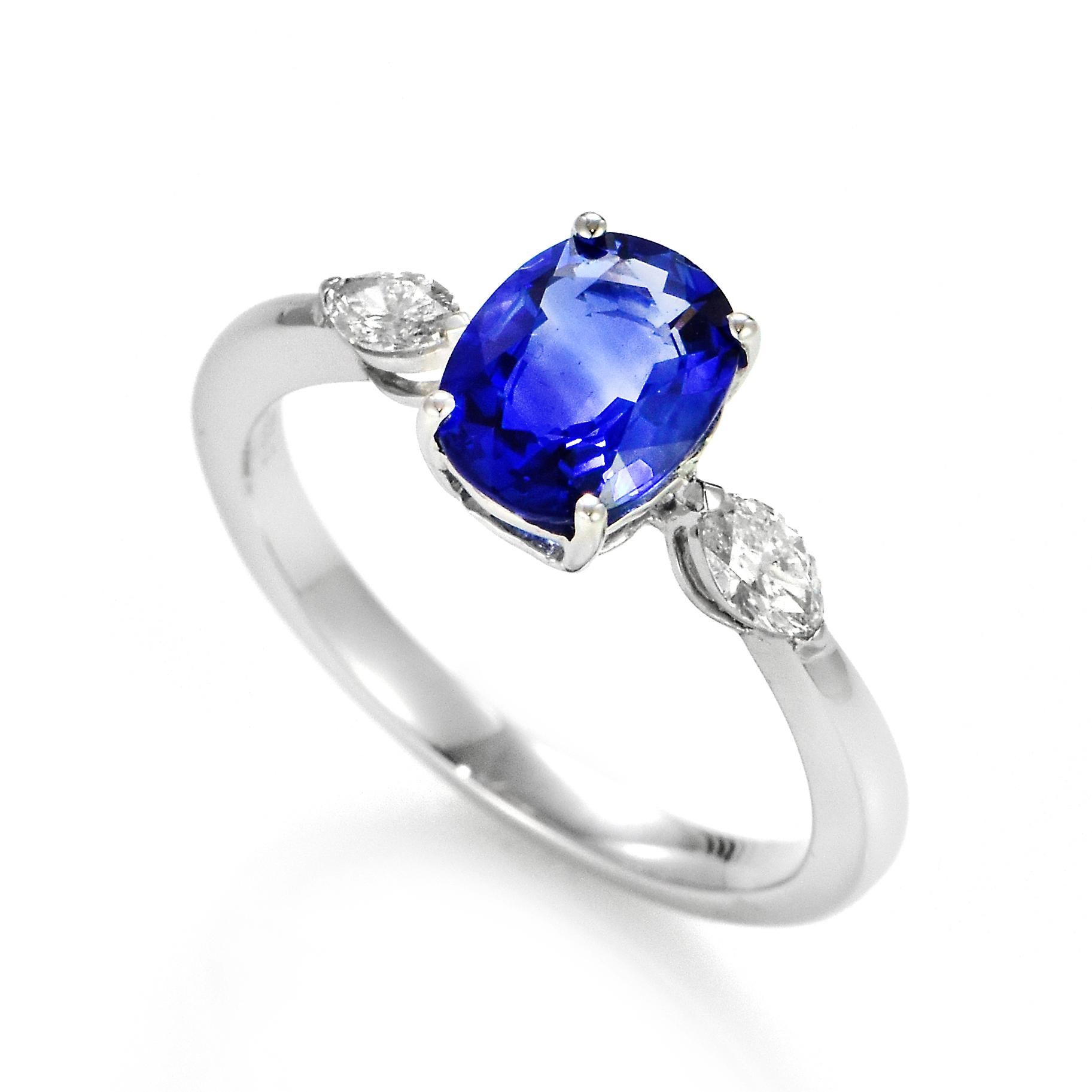 A beautiful ring featuring a 1.63 Carat Natural Sapphire and 0.22 Carats Diamond Accents set in 18 Karat White Gold. Sapphires have extraordinary durability - they excel in hardness as well as toughness and durability making them very popular in