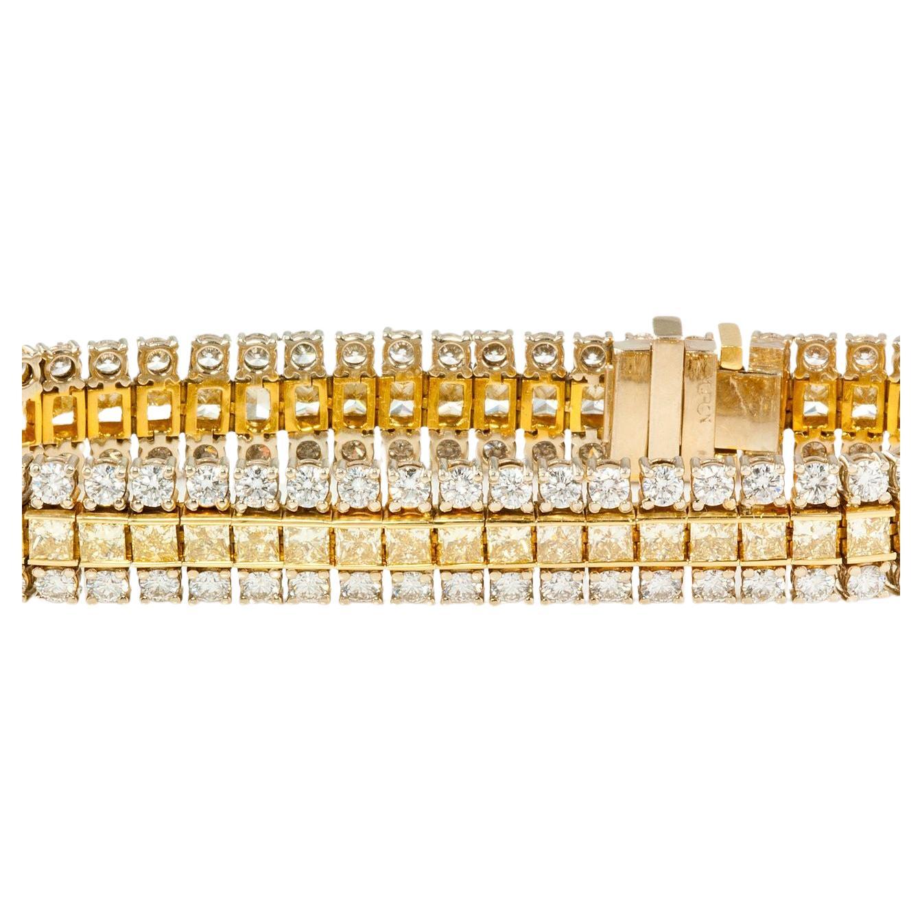 Presenting a show-stopping 16.30 carat total weight Three-Row 18KT Two-Tone Diamond Bracelet, a testament to luxury and craftsmanship.

Key Features:

18KT Two-Tone Gold: A blend of sophistication in yellow and white gold
Fancy Intense Yellow