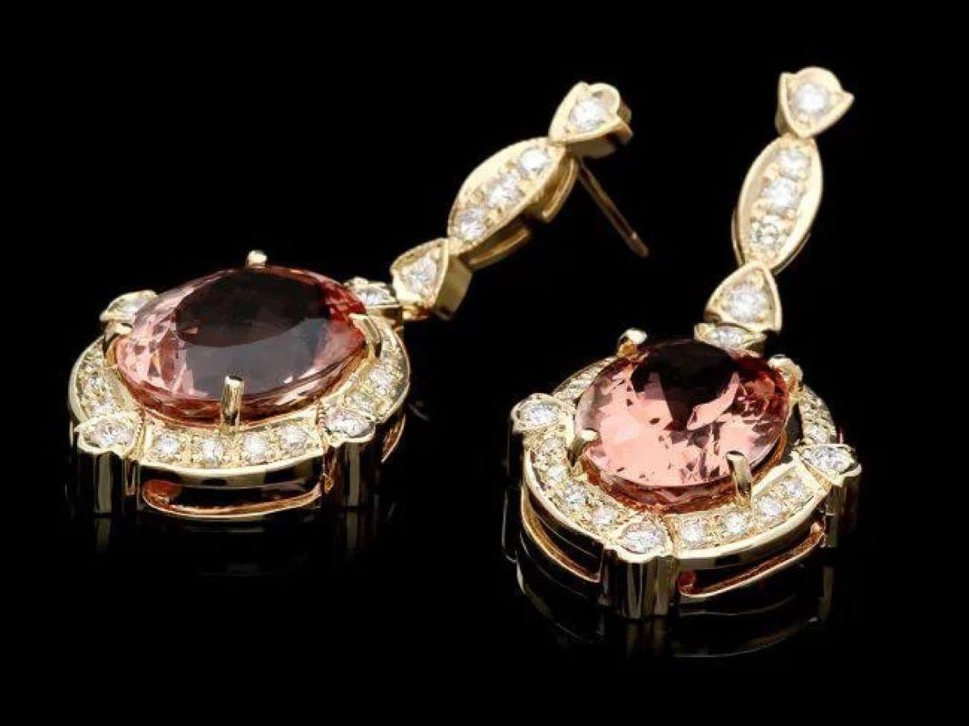 16.30 Carats Natural Morganite and Diamond 14K Yellow Gold Earrings

Total Natural Oval Morganite Weigh: Approx.  14.90 Carats

Morganite  Measures: Approx. 15 x 11 mm

Total Natural Round Cut White Diamonds Weight: Approx.  1.40 Carats (color G-H /
