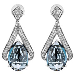 Boucles d'oreilles pendantes en or 18 carats avec topaze bleue de Londres de 16,345 carats et diamant blanc.