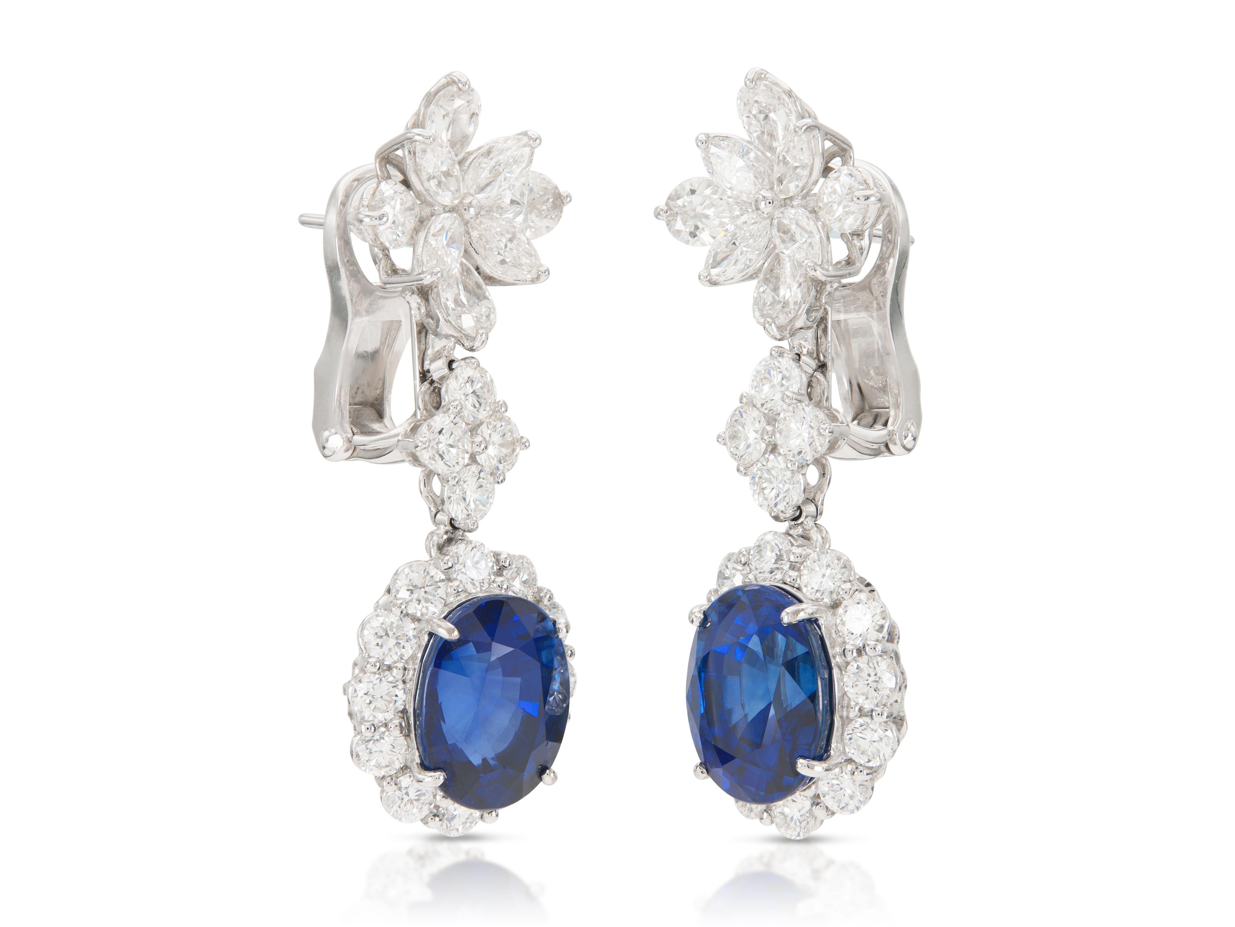 Finely crafted in 18k white gold with two AGL certified Madagascar origin Sapphires; one weighing 8.51 carats, and the other 7.84 carats.
The earrings feature Pear-Shaped, Round Brilliant, and Marquise cut Diamonds weighing approximately a total of