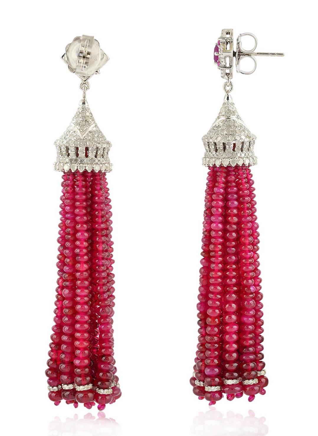 These stunning tassel earrings are handmade in 18-karat gold & sterling silver.  It is set in 163.91 carats ruby, 1.42 carats topaz and 4.07 carats of glittering diamonds. 

FOLLOW  MEGHNA JEWELS storefront to view the latest collection & exclusive
