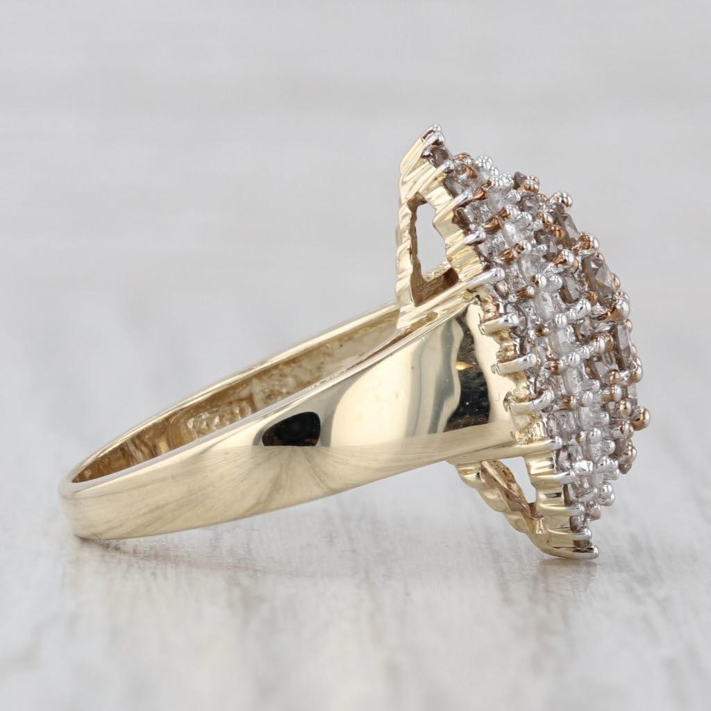 Gemstone Information:
- Natural Diamonds -
Total Carats - 0.38ctw
Cut - Round Brilliant
Color - F - G
Clarity - I3 

- Natural Diamonds -
Total Carats - 1.25ctw
Cut - Round Brilliant
Color - Argyle Champagne
Clarity - SI2 - I1

Metal: 10k Yellow