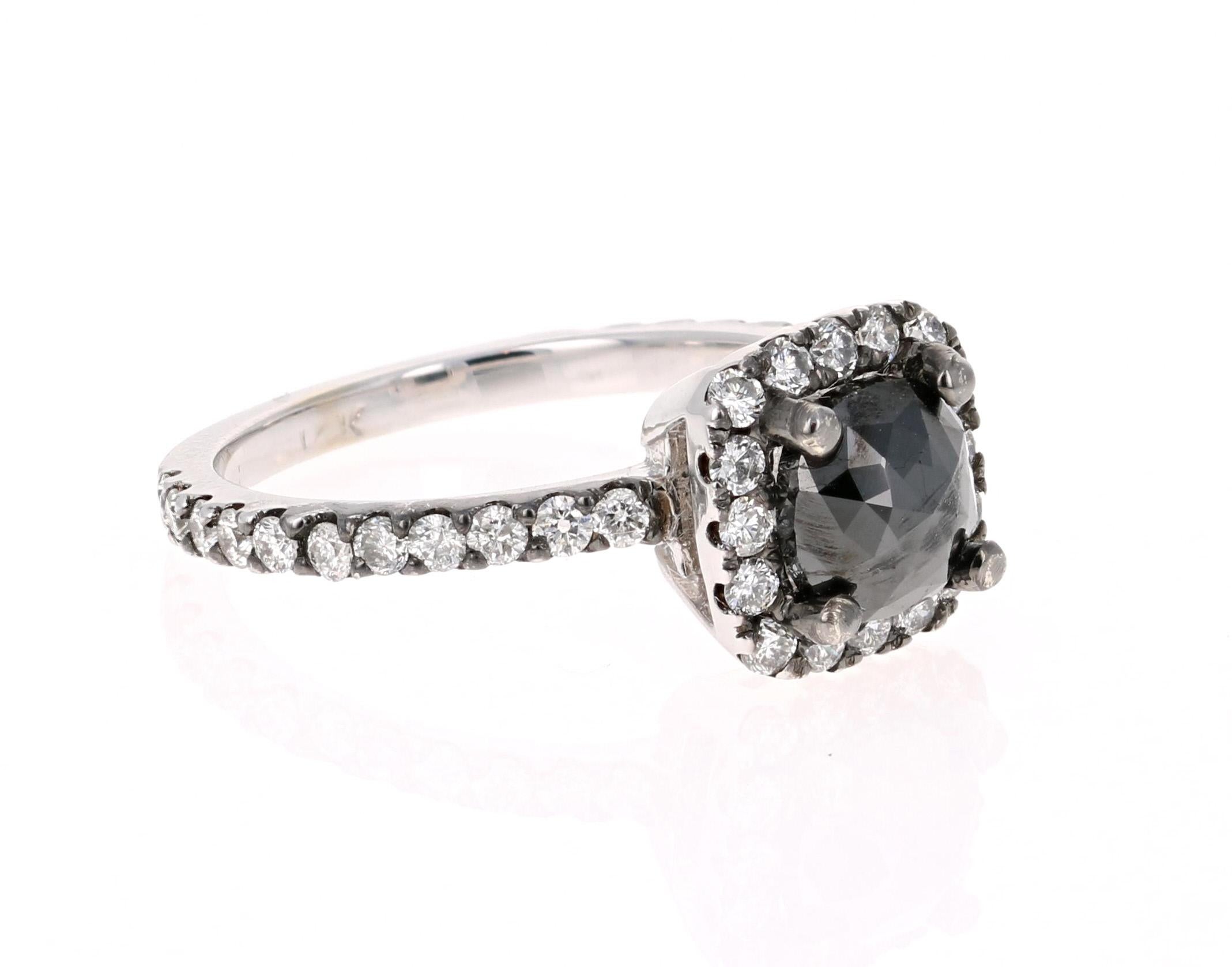 This Black and White Diamond Ring is a unique Engagement Ring or an every day ring! 

Beautiful Round Cut Black Diamond that weighs 1.02 Carats and is surrounded by 38 Round Cut Diamonds that weigh 0.62 Carats. 

Crafted in 14 Karat White Gold and