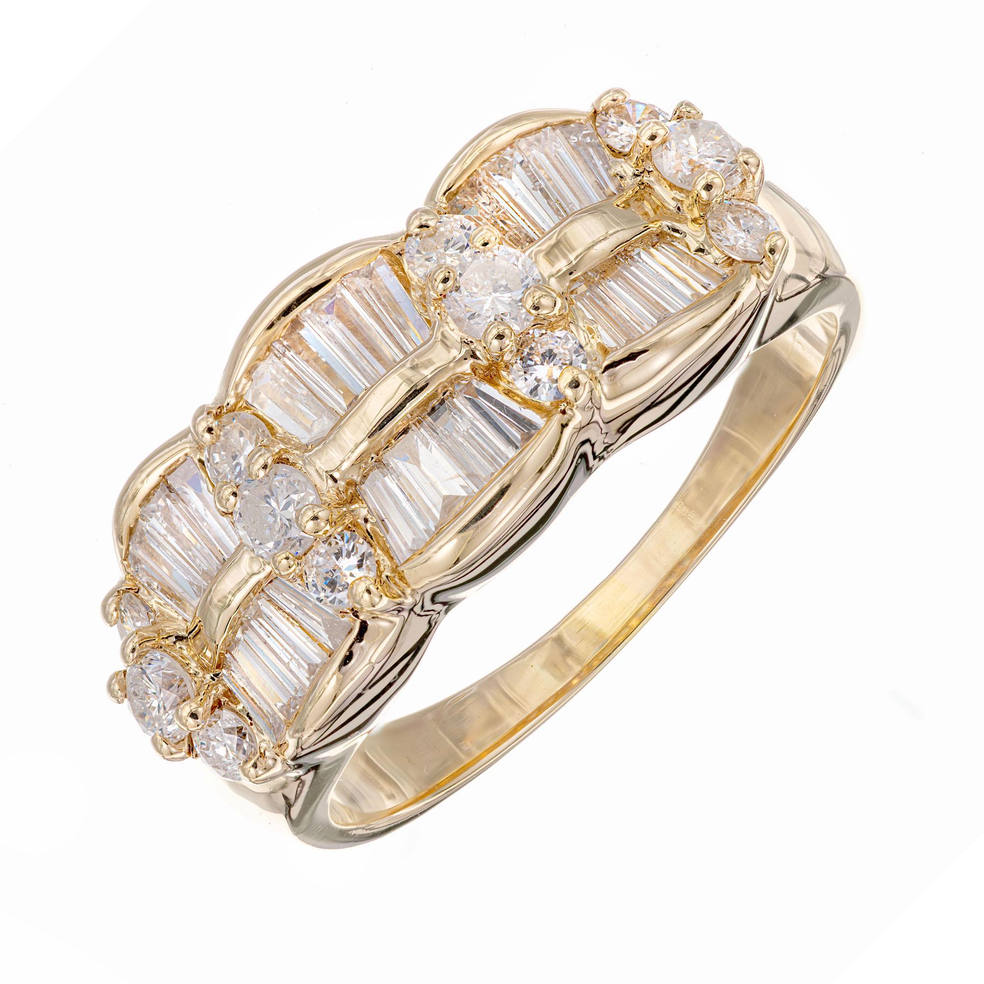 1960's diamond wave motif band ring. 12 round and 24 tapered baguette diamonds in a 14k yellow gold setting. 

12 round diamonds, approx. total weight .31cts, H, SI
24 tapered baguette diamonds, approx. total weight 1.33cts, H, SI
Size 9.75 and