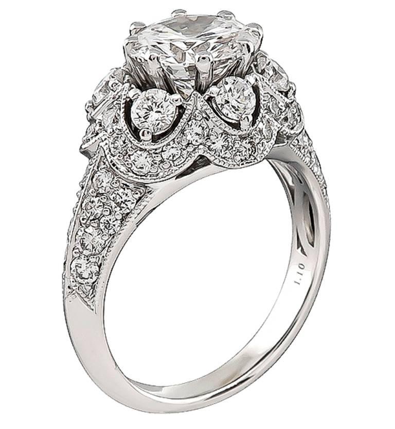 This unique stunning 18k white gold engagement ring is centered with a sparkling GIA certified round brilliant cut diamond that weighs 1.64ct. graded D color with VVS2 clarity. Accentuating the center stone are high quality round cut diamonds that