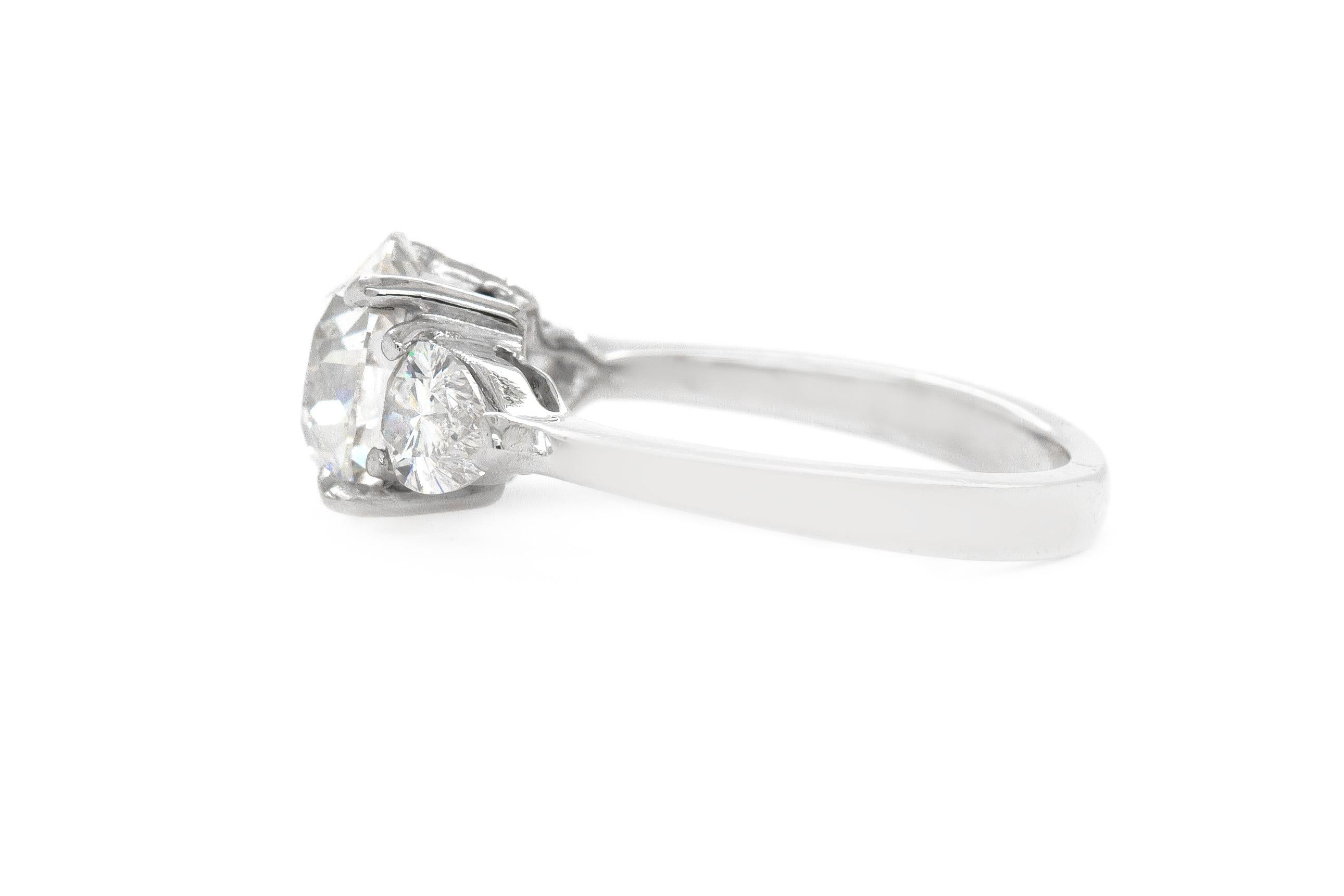 Finely crafted in platinum with a center Old European cut diamond weighing 1.64 carats. The ring features two pear cut side diamonds weighing approximately a total of 0.60 carats.
Color G Clarity SI2
GIA Certified