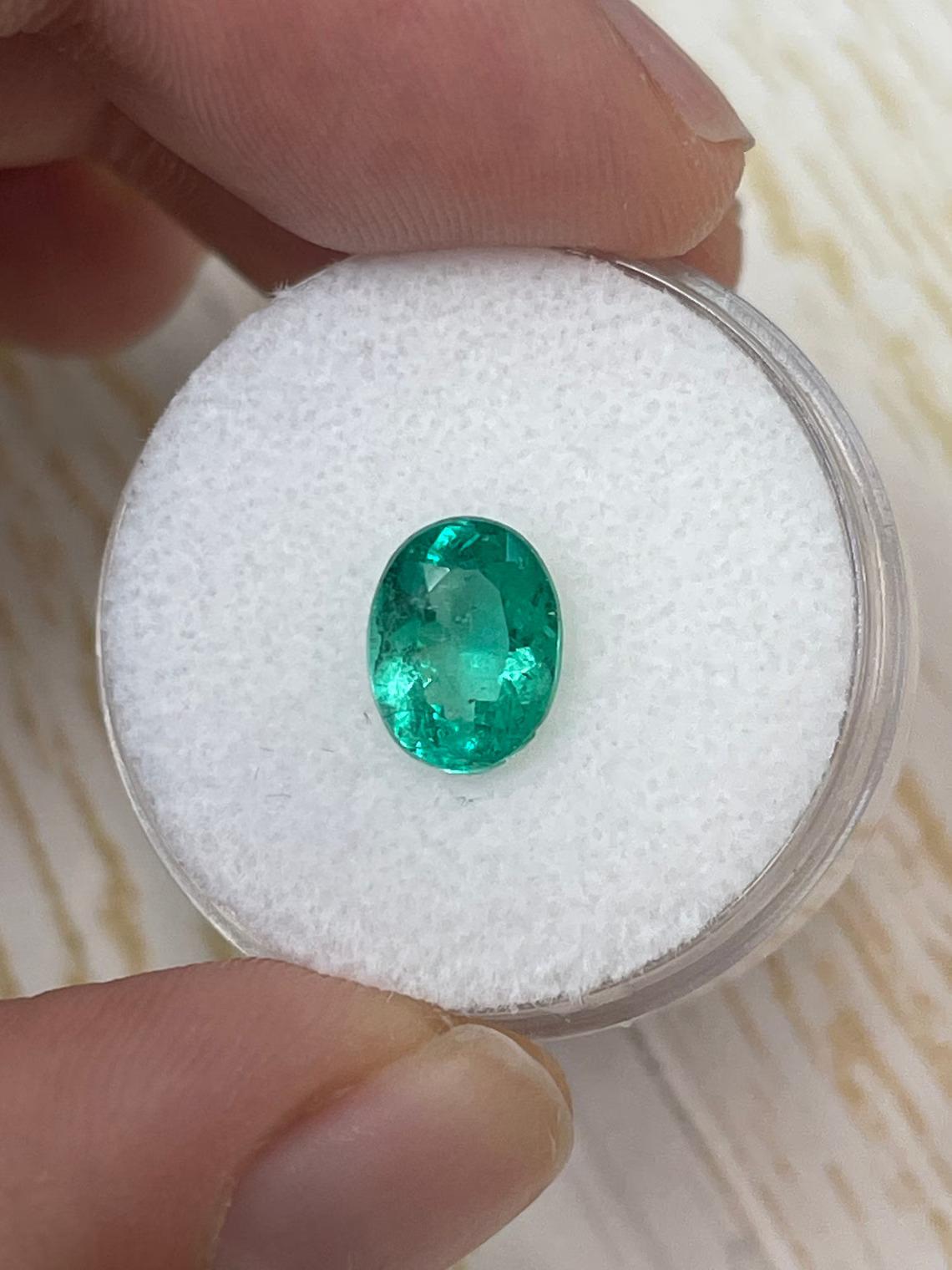 Stone: Emerald
Weight: 1.64-carats
Shape: Oval Cut
Clarity: Transparent
Luster: Very Good
Color: Green
Measurements: 9.09mm x 6.90mm x 4.68mm
Geographic Origin: Colombia
Treatment: Natural, Oiling

This emerald has a chip on its bottom edge which