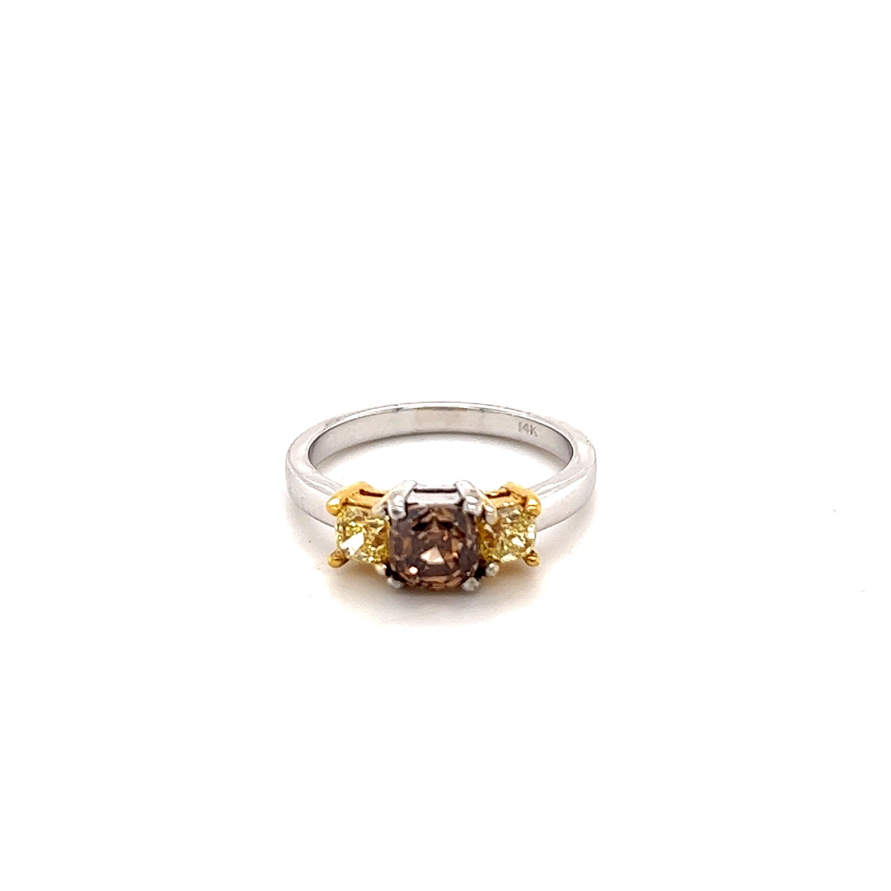 Natural Brown Diamond Natural Yellow Diamond Three Stone Engagement Ring

The Asscher Cut Brown Diamond weighs 1.02 Carats, Clarity: VS and has 2 Asscher Cut Yellow Diamonds on each side that weigh 0.62 Carats, Clarity: VS The total carat weight of