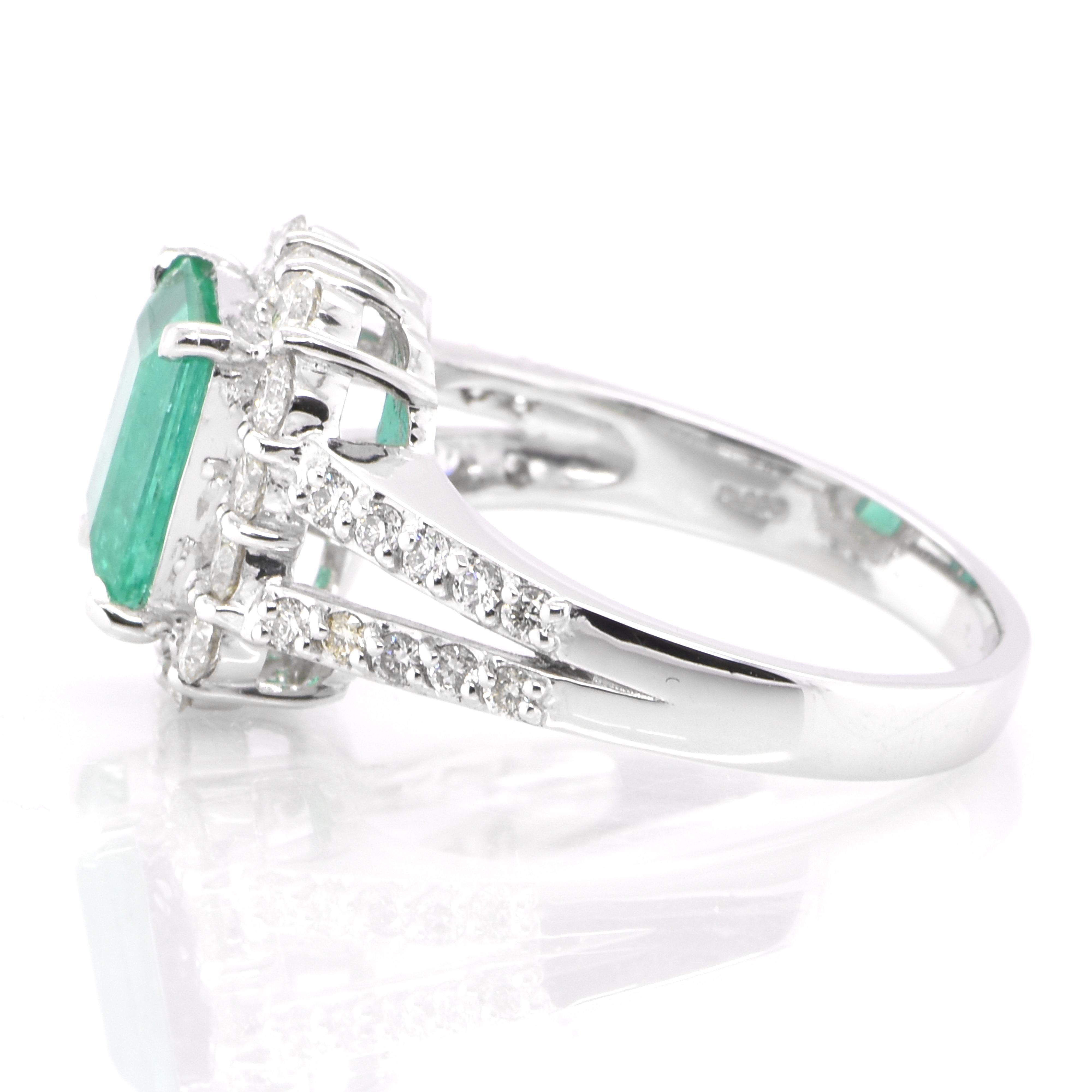 Emerald Cut 1.64 Carat Natural Emerald and Diamond Halo Ring Set in Platinum For Sale