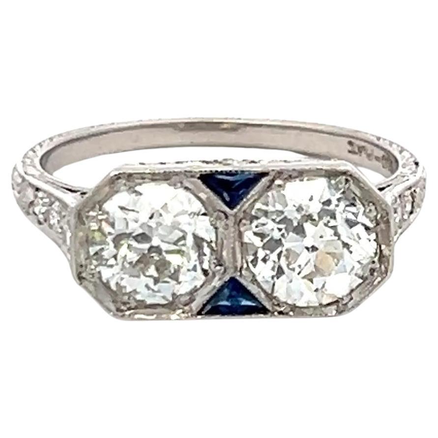 1.64 Carat Old European Cut Diamond 0.10 Carat Sapphire Platinum Two-Stone Ring For Sale