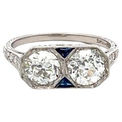 1.64 Carat Old European Cut Diamond 0.10 Carat Sapphire Platinum Two-Stone Ring
