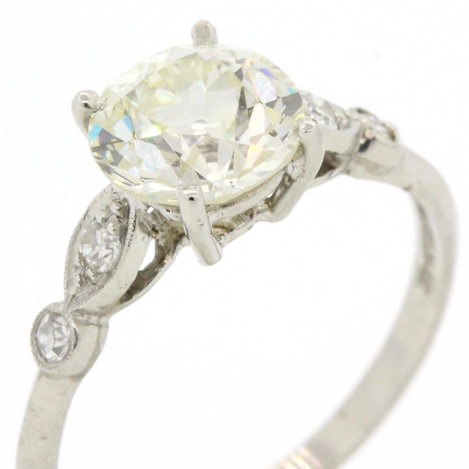 Traditional and gorgeous!  A 1940s platinum ring flaunting a 1.64 carat Old European Cut Diamond,  E.G.L. USA certified K color - VS2 clarity; measuring 7.43 x 7.16 x 4.82  mm.  The simple  setting is accented with marquise and round design details