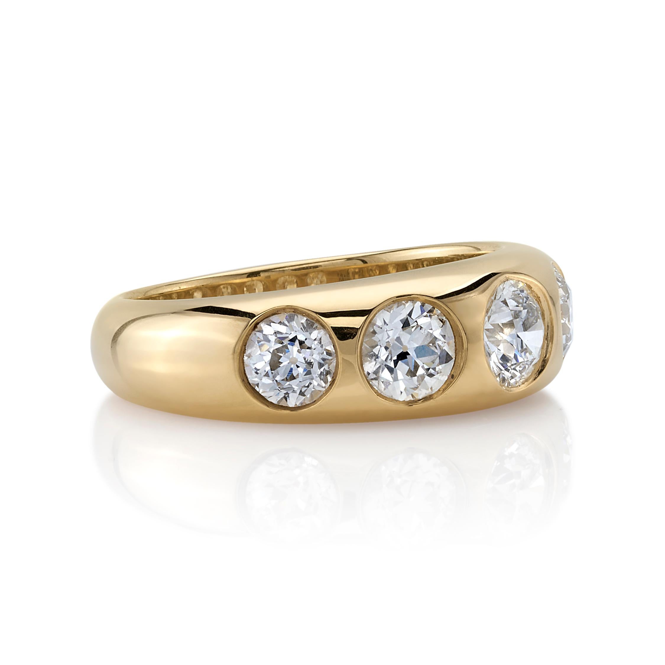 1.64ctw G-H/VS-SI old European cut diamonds set in a handcrafted 18K yellow gold band.

Ring is a currently a size 6 and can be sized to fit.