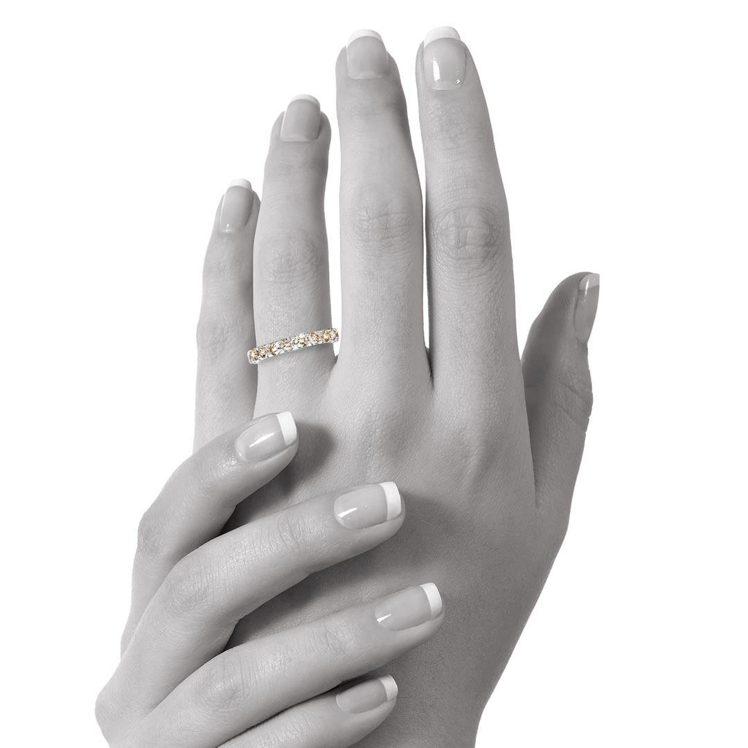 This bridal ring displays stunning round champagne diamonds in a beautiful scalloped shared-claw setting. The total weight for the diamonds is 1.64 carat, Colour Champagne, Clarity VS.

Made in 18 Karat white gold. AU Ring Size N. US Ring 6 1/2. EU
