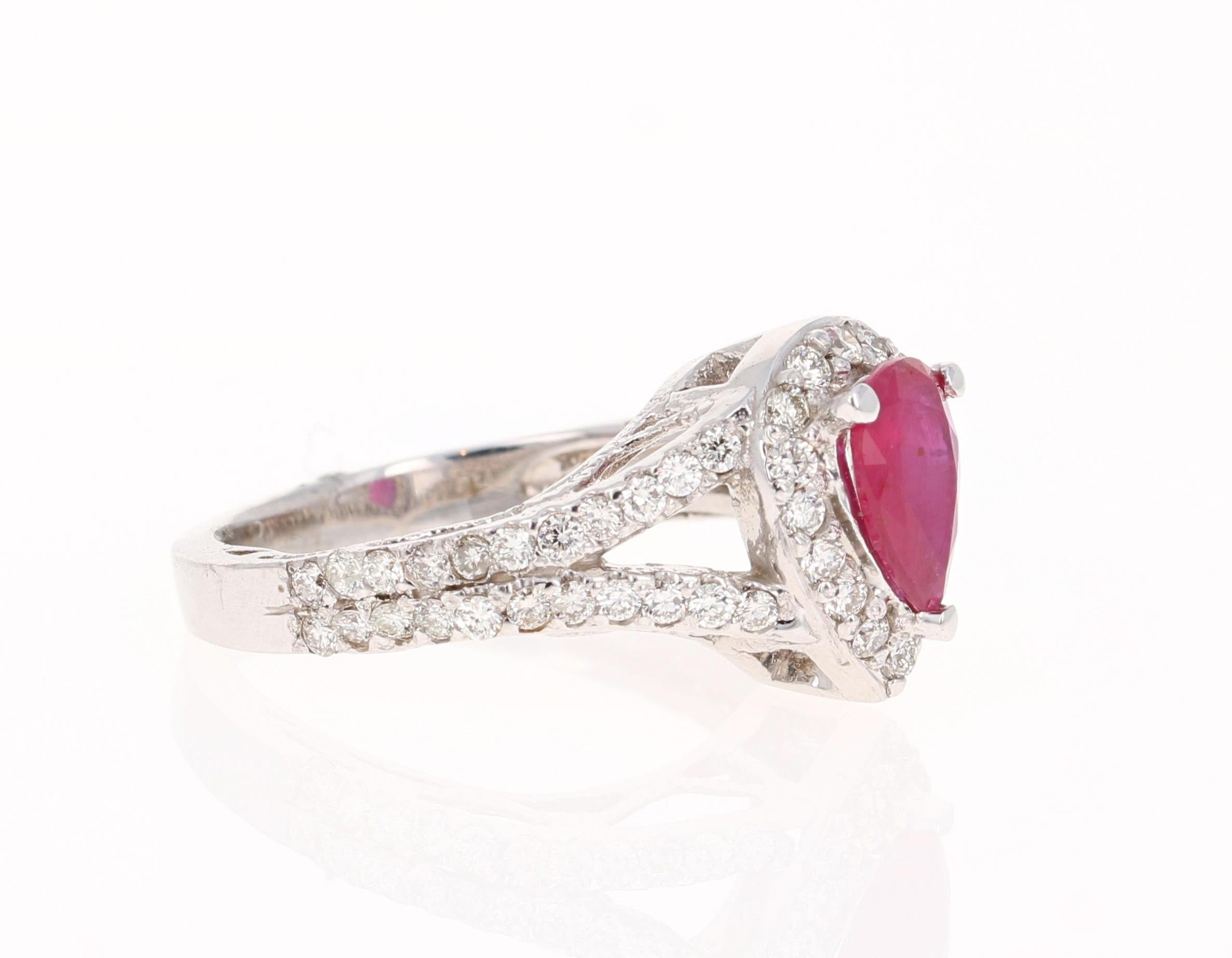 This ring is truly a beauty! 
There is a Pear Cut Ruby set in the center of the ring that weighs 0.88 carats. There are also 60 Round Cut Diamonds that weigh 0.76 carats (Clarity: VS2, Color: H).  The total carat weight of the ring is 1.64 carats. 
