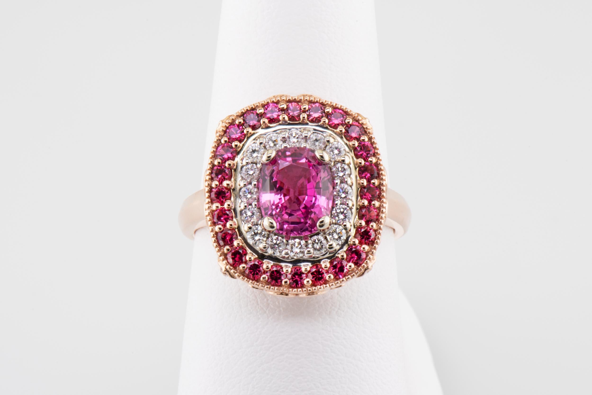 1.64 Carat Sri Lanka Pink Sapphire No Heat Ring with Pink Spinel Diamond Halo

This spectacularly sparkly fashion ring is two-tone 14 karat rose and white gold. The center gem is a 1.64 carat natural, no heat, pink sapphire, it is surrounded by a