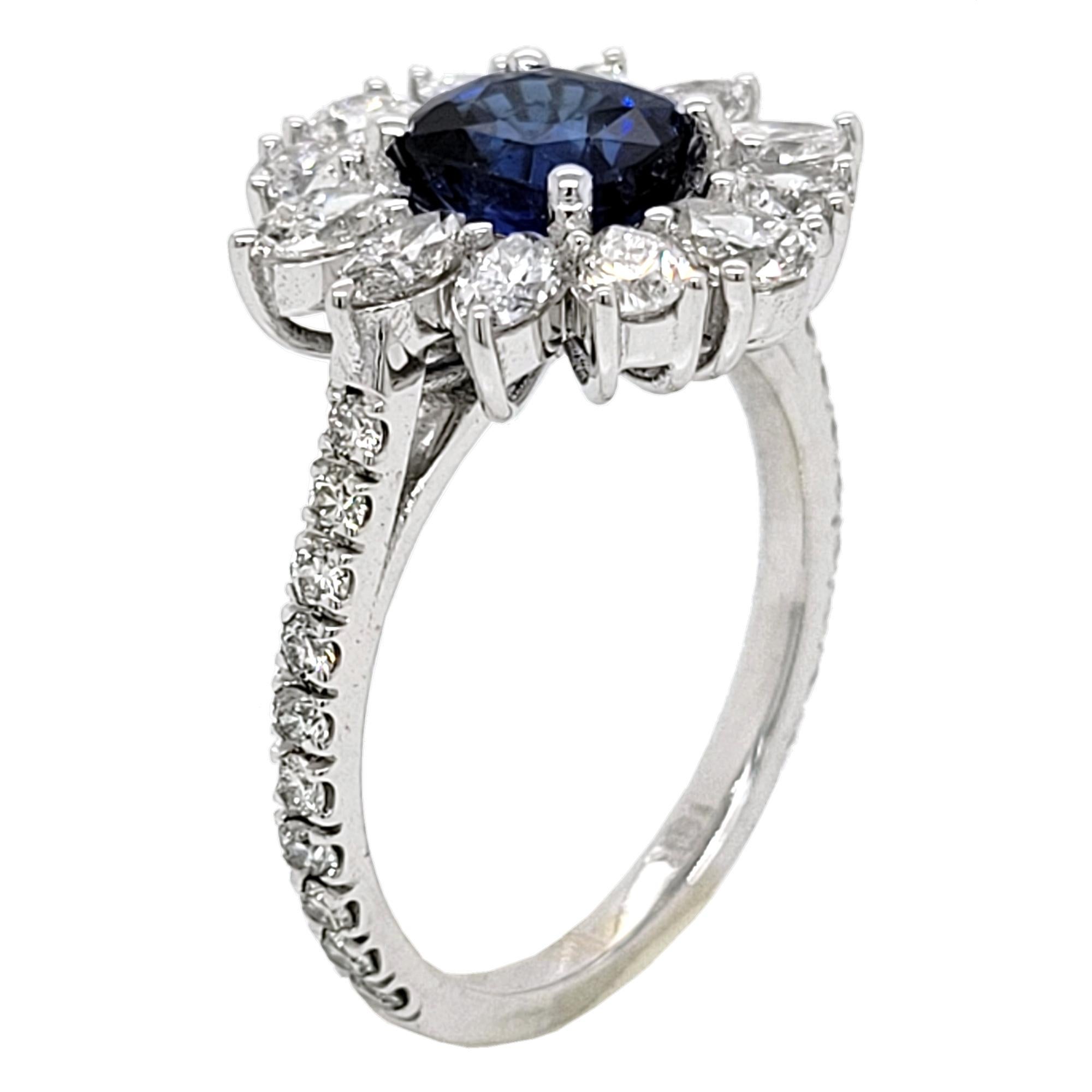 A  Beautiful Color 1.64 Ct Cushion Shaped Sapphire set in a gorgeous 18k gold  Pave set engagement Ring with halo of Pear and Marquise Shape Diamonds. Total diamond weight of 1.58 Ct. on the side. 

Center stone: 1.64 Ct Cushion Shape Sapphire
Side