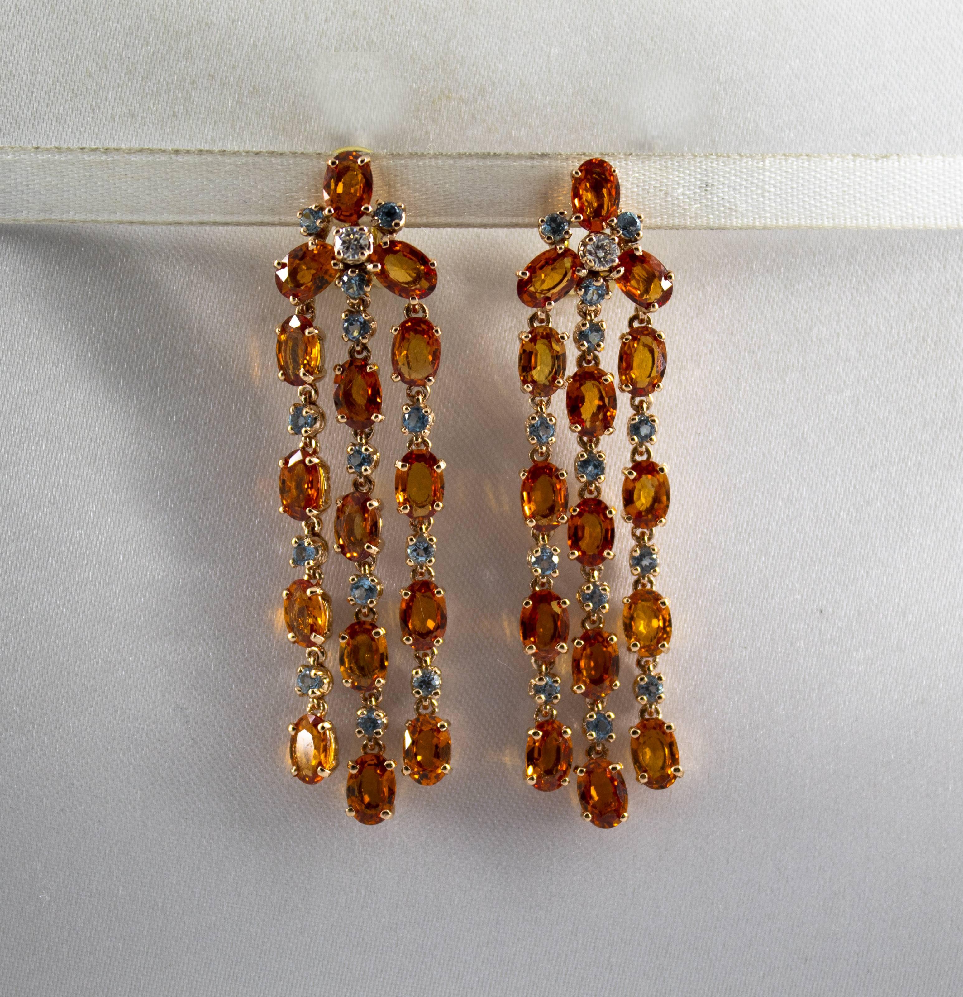 These Earrings are made of 14K Yellow Gold with 18K Yellow Gold Clips.
These Earrings have 0.14 Carats of White Diamonds.
These Earrings have 16.40 Carats of Yellow Sapphires.
These Earrings have also 1.10 Carats of Blue Topaz.
All our Earrings have