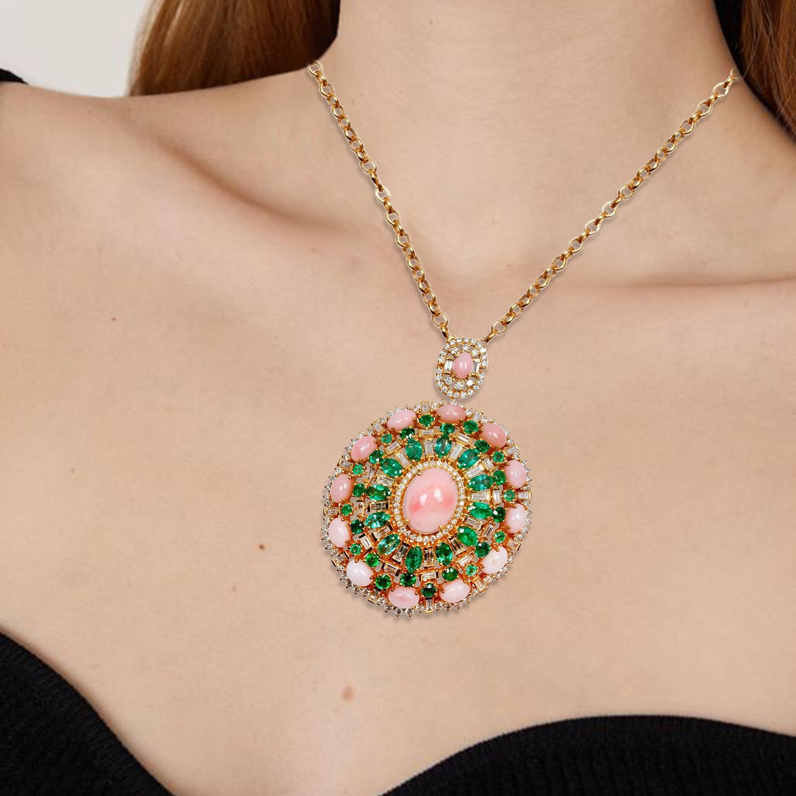 Cast from 14-karat gold, this pendant necklace is hand set with 16.40 carats pink opal, emerald and 4.40 carats of sparkling diamonds on the 29