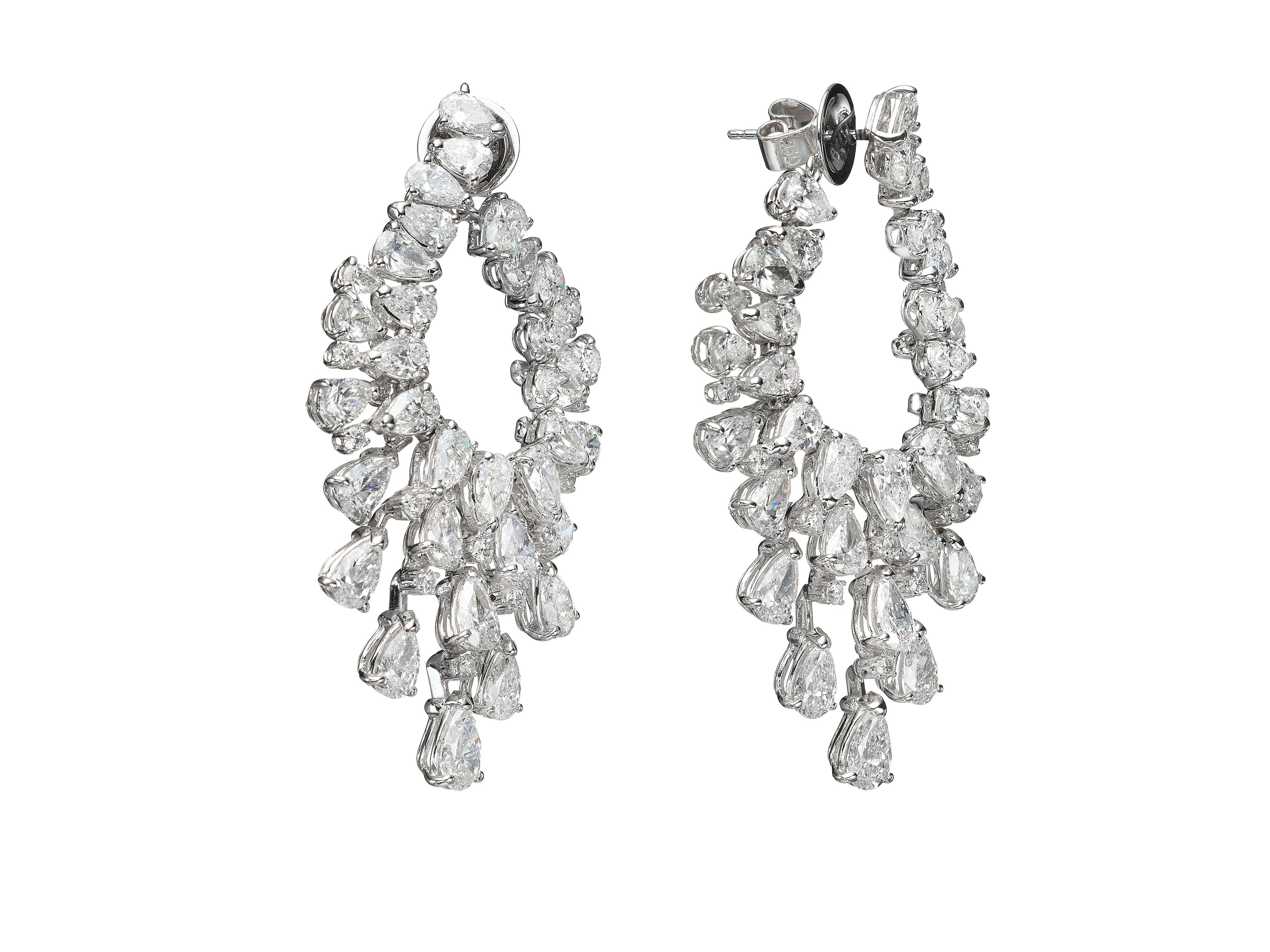 An impressive pair of Chandelier earrings by Butani, combines contemporary elegance with refined charm.  Round brilliant cut diamonds delicately shimmer with an array of light-catching pear-shaped diamonds.  Total diamond weight 16.41 carats.  In