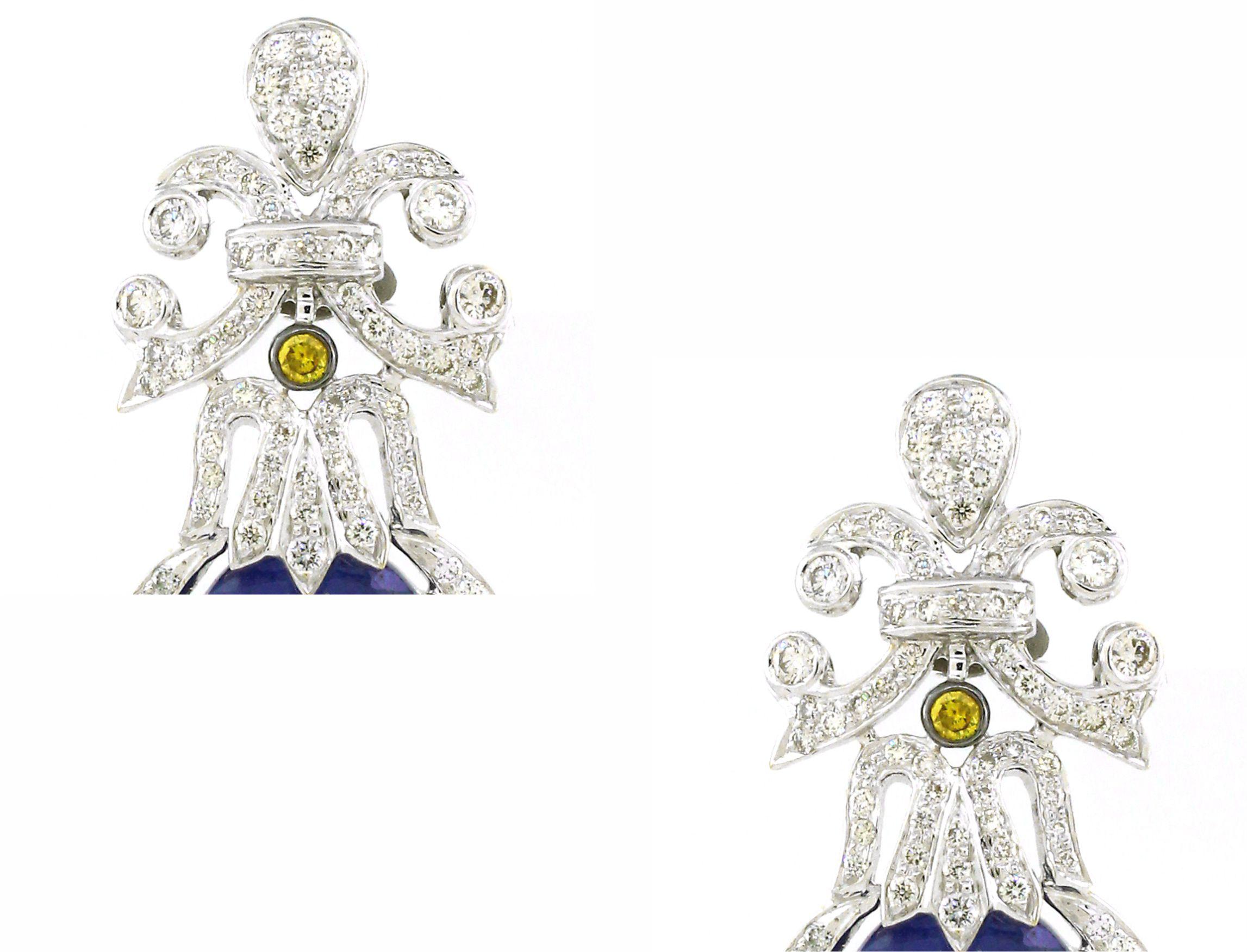 Indulge in the enchanting allure of our Tanzanite Chandelier Earrings, a harmonious blend of sophistication and splendor. Nestled at the core of each earring is a mesmerizing Tanzanite gemstone, boasting a substantial weight of 16.45 carats,