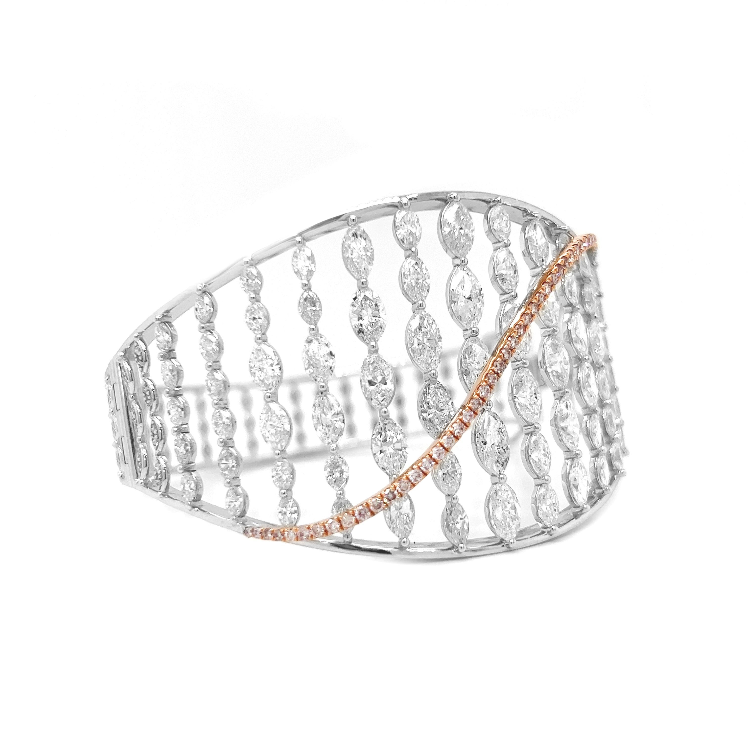 16.46 Carat Natural Mined Marquise/Round Fancy Yellow Pink Diamond Bangle 18KT

Elevate your style with the unmatched beauty of this 16.46 Carat Natural Mined Marquise/Round Fancy Yellow Pink Diamond Bangle in 18KT gold. This bangle is a true
