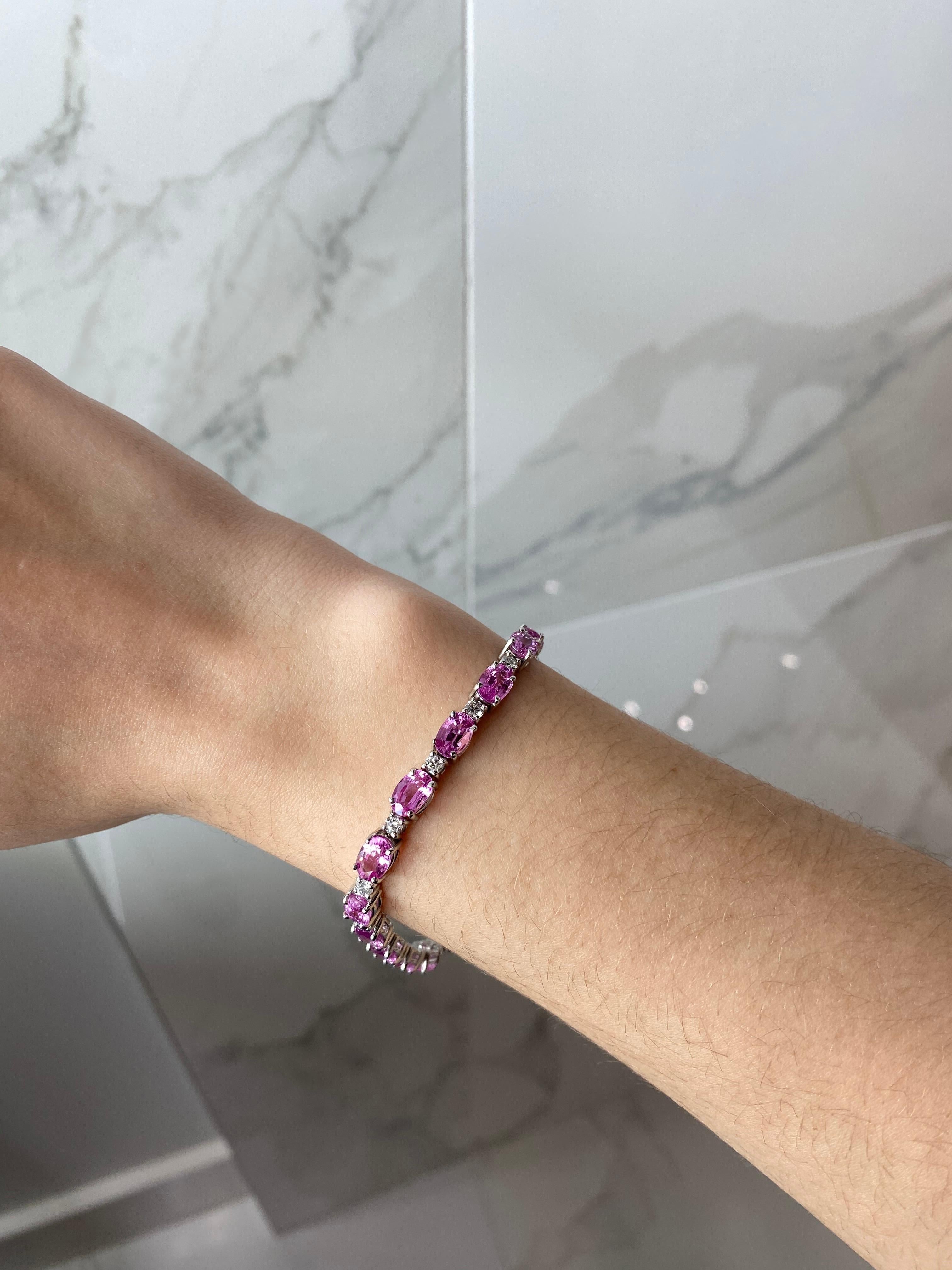 This bracelet adds some color and pop to the standard layerable tennis bracelets. With 16.48ct total weight in oval shape pink natural sapphires and 1.72ct total weight in round diamonds in between, you cannot go wrong with this sleek but fun